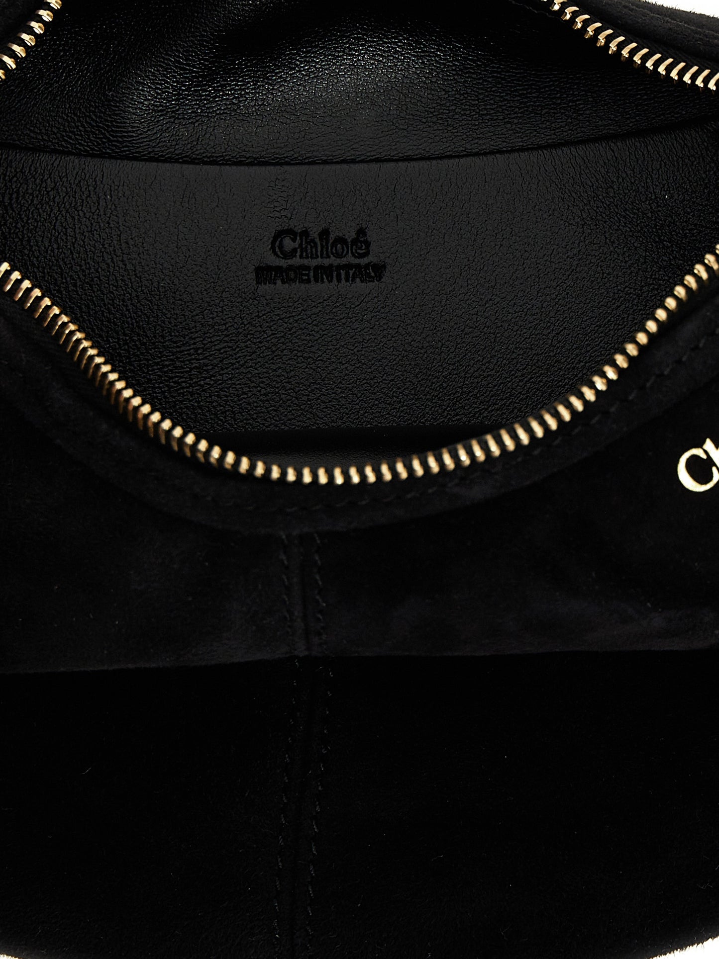 Mini Hobo Handbag by Chloé for women in plush viscose goat leather & fur black features a contemporary silhouette, showcasing a secure zipper, ample , and contemporary shoulder-strap, adjustable-strap & handle for a sophisticated look.