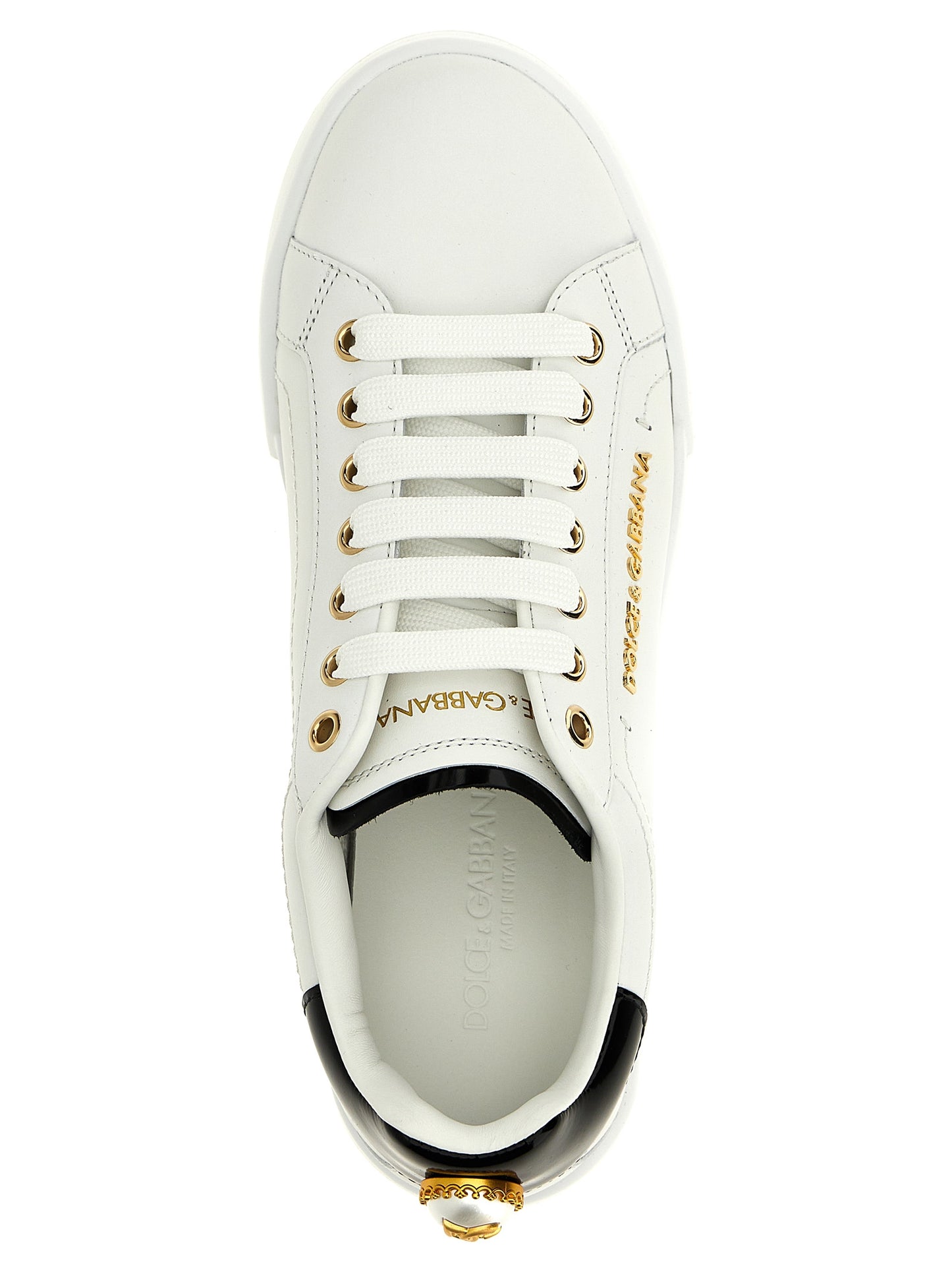 Sneakers by Dolce & Gabbana for women in calfskin leather bicolour, black, pearl & white presents a sumptuous silhouette, artfully capturing the essence of the Women's Low Top Calfskin Leather Sneakers with its sumptuous low-top style design.
