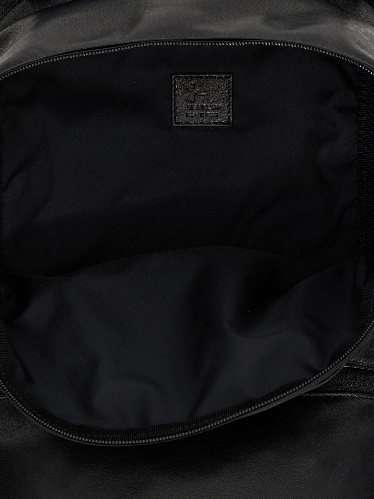 Backpack by Balenciaga for men in polyester & lamb leather bicolour, black, white & print features a utilitarian chic Polyester & Lamb Leather Backpack design with a secure zipper, ample external-pockets, and versatile handle, backpack-strap & adjustable-strap for a utilitarian chic finish.