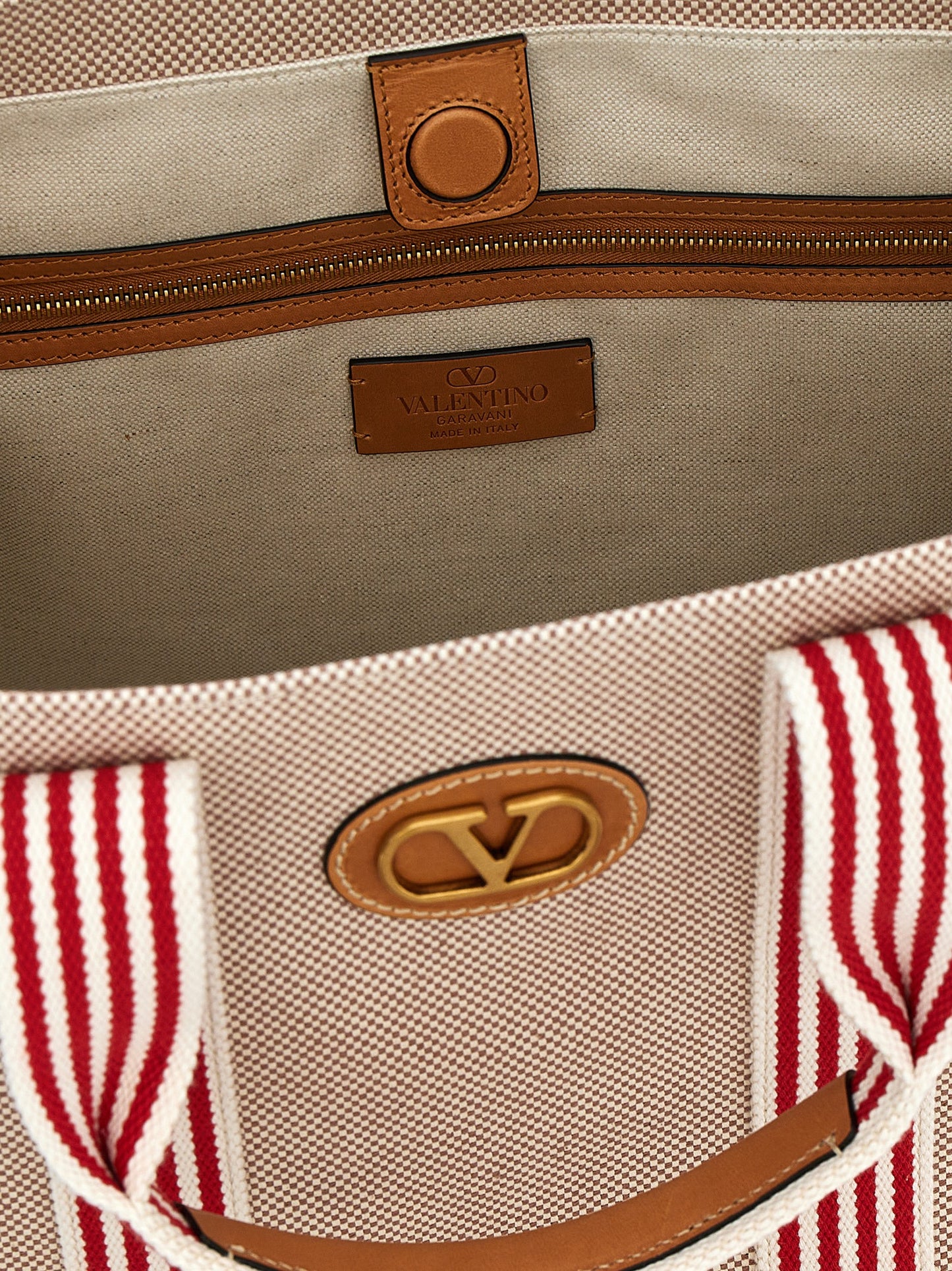 Handbag by Valentino Garavani for unisex in cotton & leather multicolor & signature features a exquisite silhouette, showcasing a secure magnetic and exquisite with versatile adjustable-strap & handle for a exquisite finish.