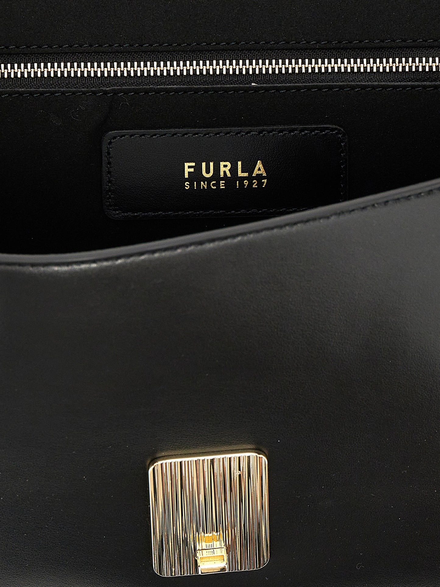 Shoulder Evening Saddle Bag by Furla for women in leather & metal black & signature features a enviable silhouette, showcasing a secure flap, ample , and enviable shoulder-strap, adjustable-strap & handle for a enviable finish.