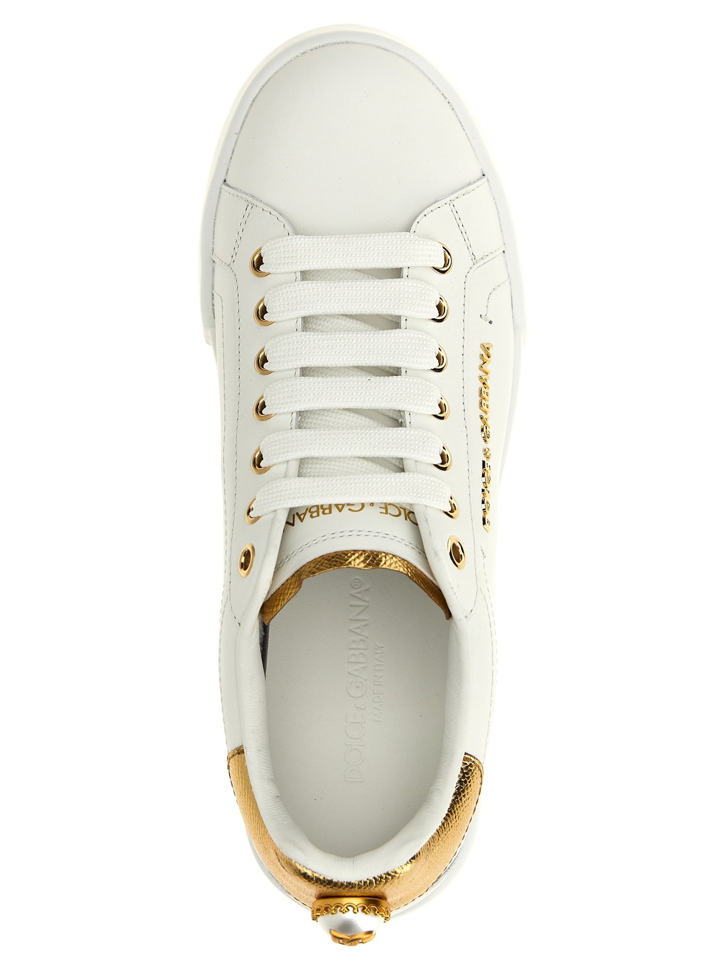 Sneakers by Dolce & Gabbana for women in calfskin leather gold & pearl presents a impeccable silhouette as Women's Low Top Calfskin Leather Sneakers, expertly defined by a impeccable low-top style for a impeccable, high-fashion look.