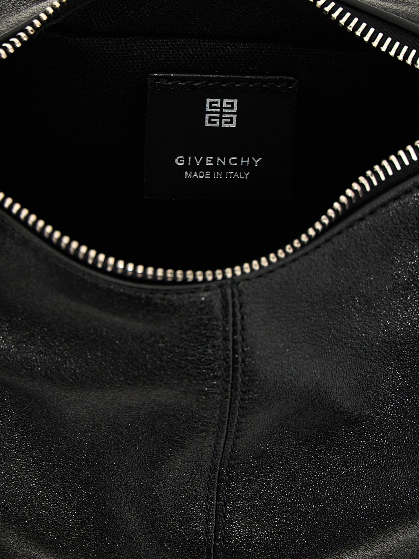 Shoulder Bag by Givenchy for women in polyester & lamb leather black features a distinguished silhouette, showcasing a secure zipper & buckle and distinguished with versatile shoulder-strap & handle for a distinguished finish.