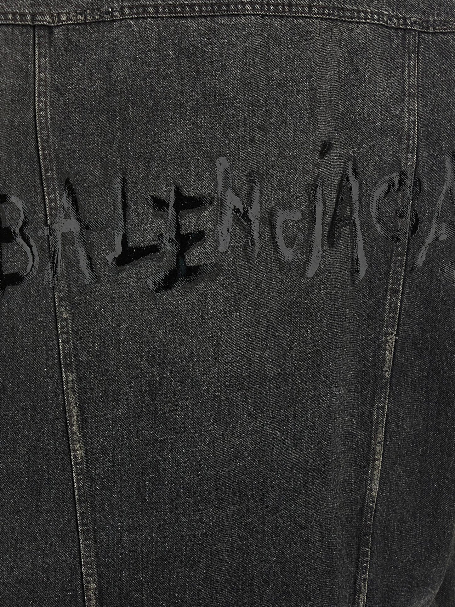Trucker Jacket by Balenciaga for women in vinyl & denim cotton gray & print showcases a bohemian silhouette, artfully detailed with a bohemian and signature pockets for a truly bohemian finish.