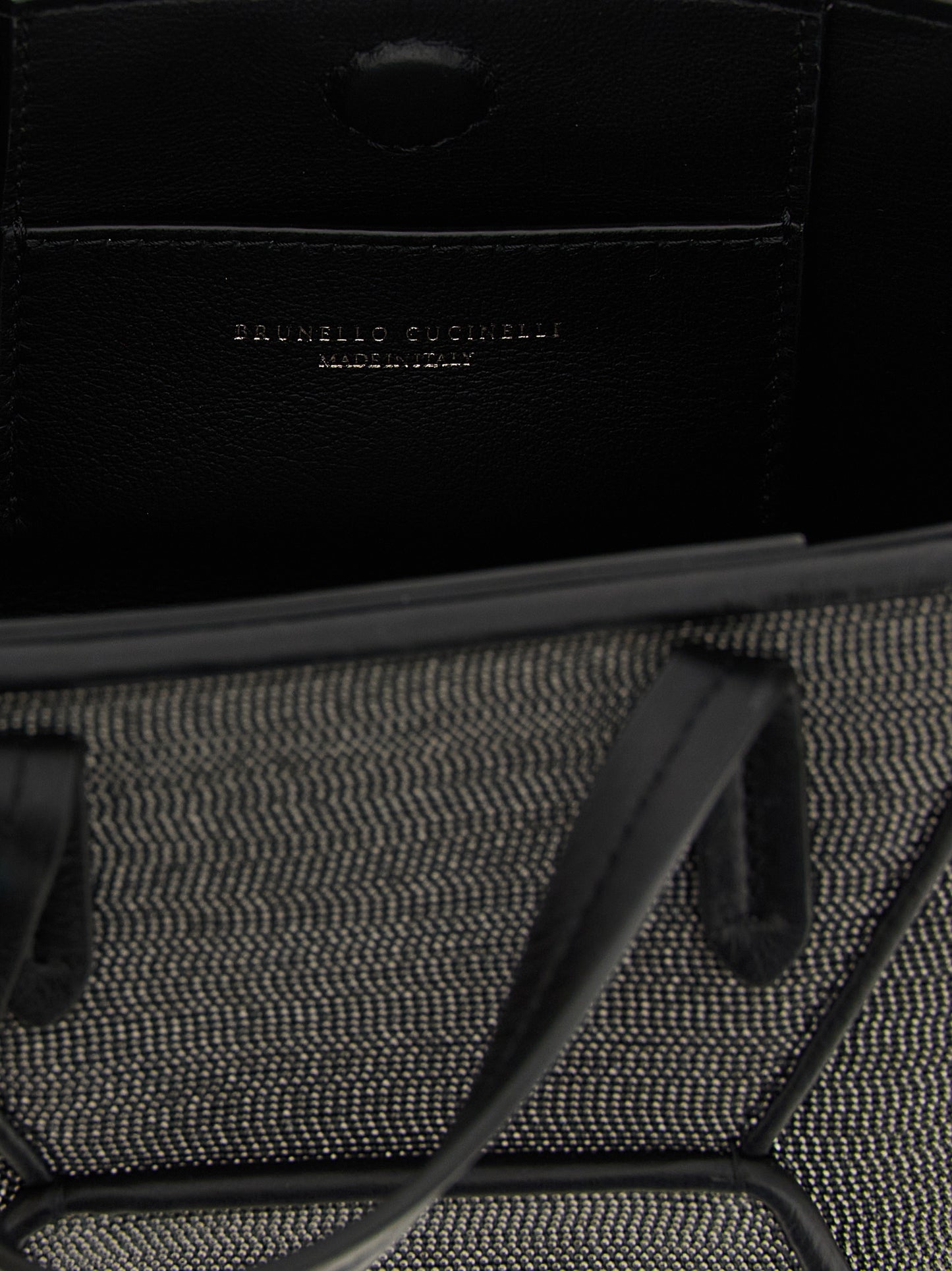 Mini Crossbody Handbag by Brunello Cucinelli for women in lambskin leather black & signature features a contemporary silhouette, showcasing a secure magnetic, ample , and contemporary crossbody-strap, shoulder-strap, adjustable-strap & handle for a sophisticated look.
