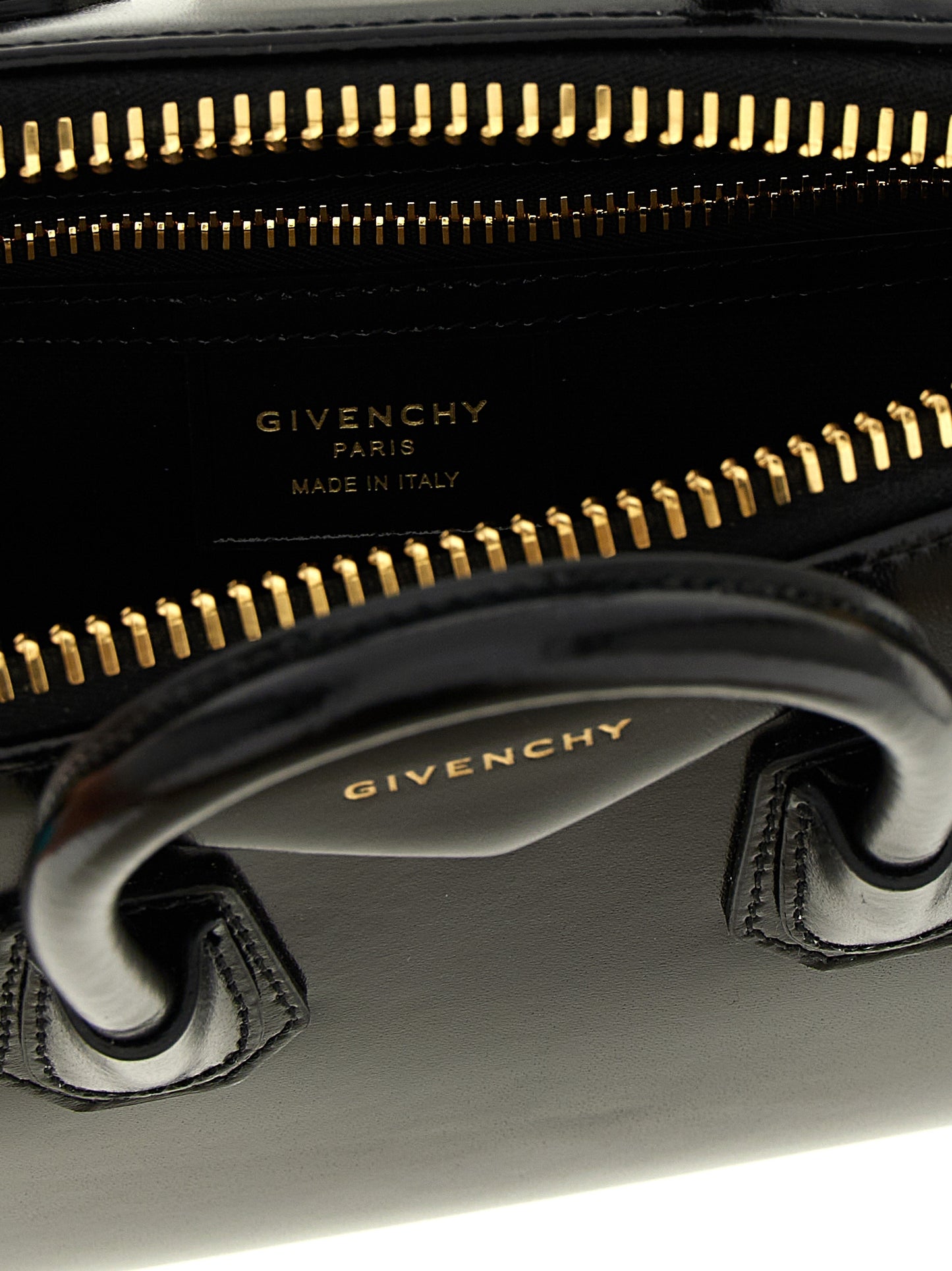 Mini Evening Handbag by Givenchy for women in calfskin leather black & silver features a contemporary silhouette, showcasing a secure , ample , and contemporary shoulder-strap, handle & detachable-strap for a sophisticated look.
