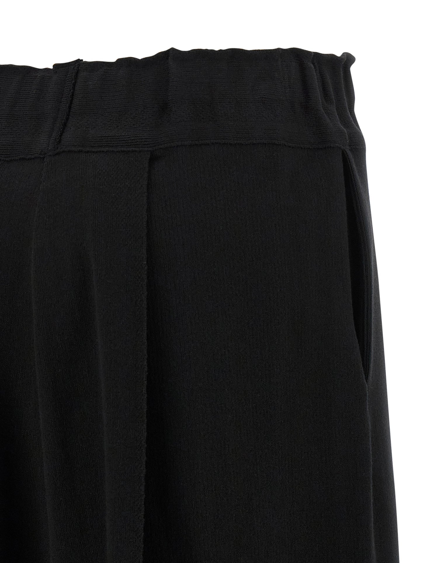Casual Pants by Issey Miyake for women in polyurethane & nylon black presents a tailored silhouette, showcasing a tailored wide and long cut with a refined for a truly tailored aesthetic.