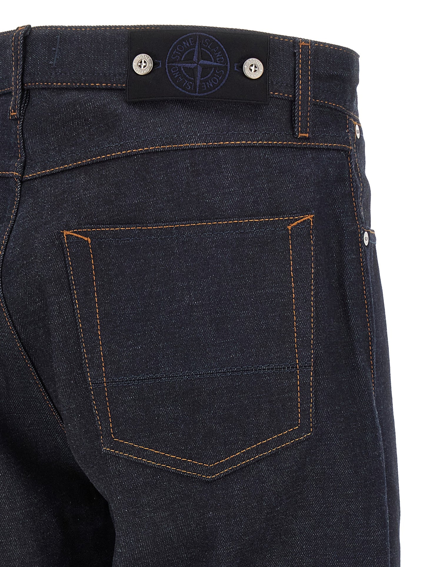 Jeans by Stone Island for men in organic cotton denim blue, indigo & signature features a polished silhouette with a polished straight-leg, reaching a polished long and finished with a polished .