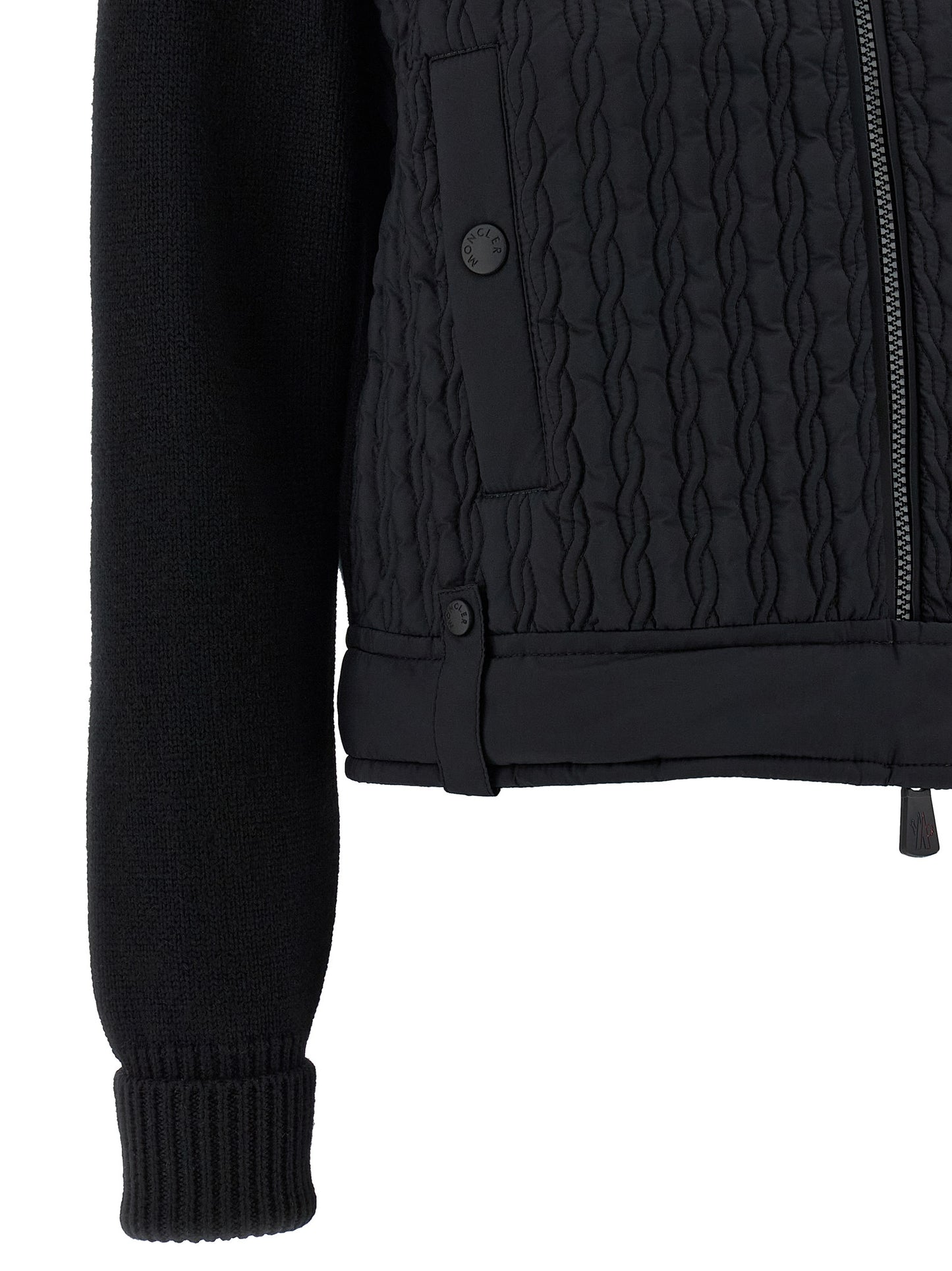 Cardigan by Moncler Grenoble for women in polyamide wool black showcases a captivating silhouette, artfully detailed with a captivating and for a truly sophisticated captivating look.