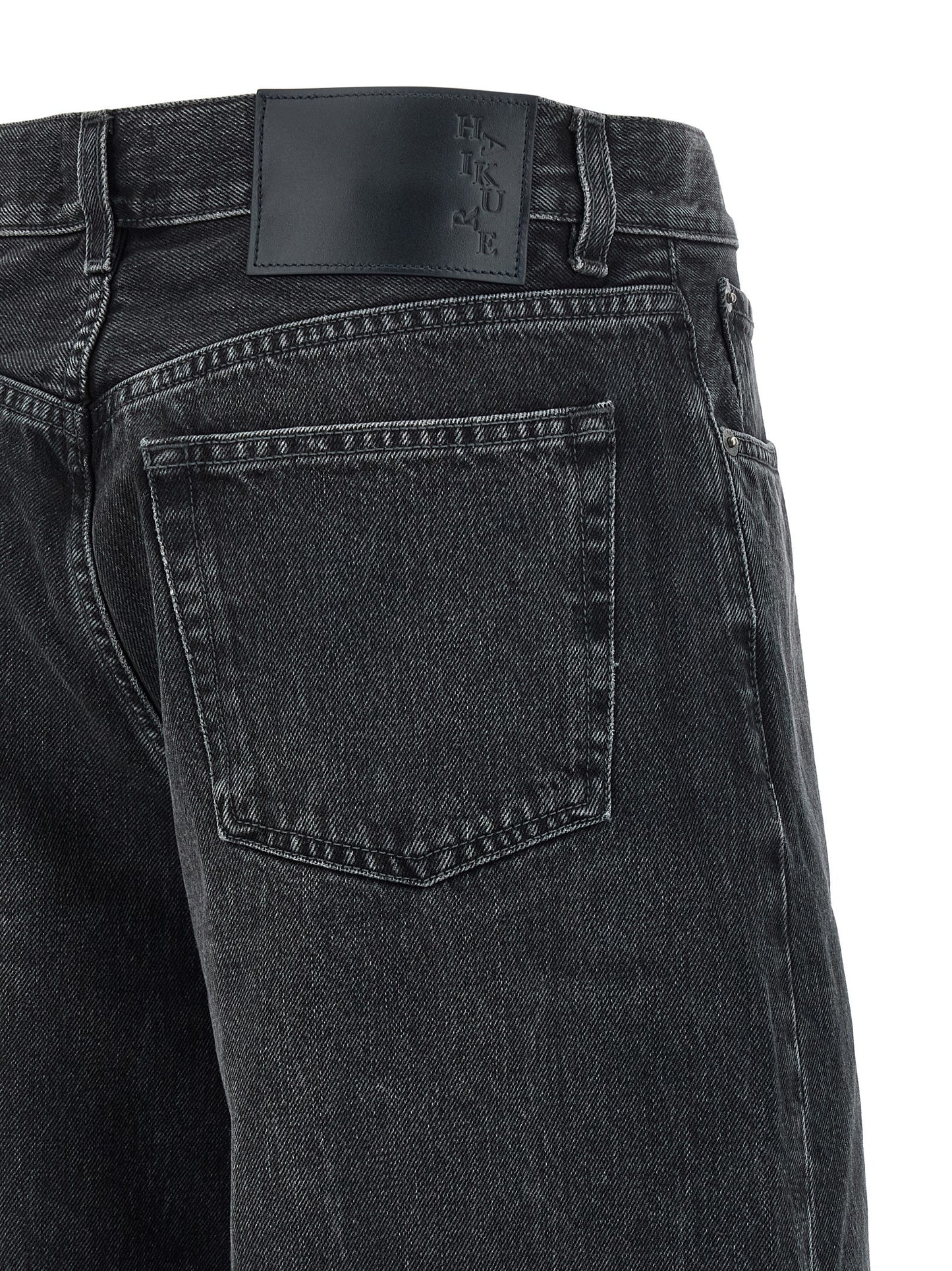 Jeans by Haikure for women in denim cotton black presents a tailored silhouette, showcasing a tailored straight-leg & wide and long cut with a refined high rise for a truly tailored aesthetic.
