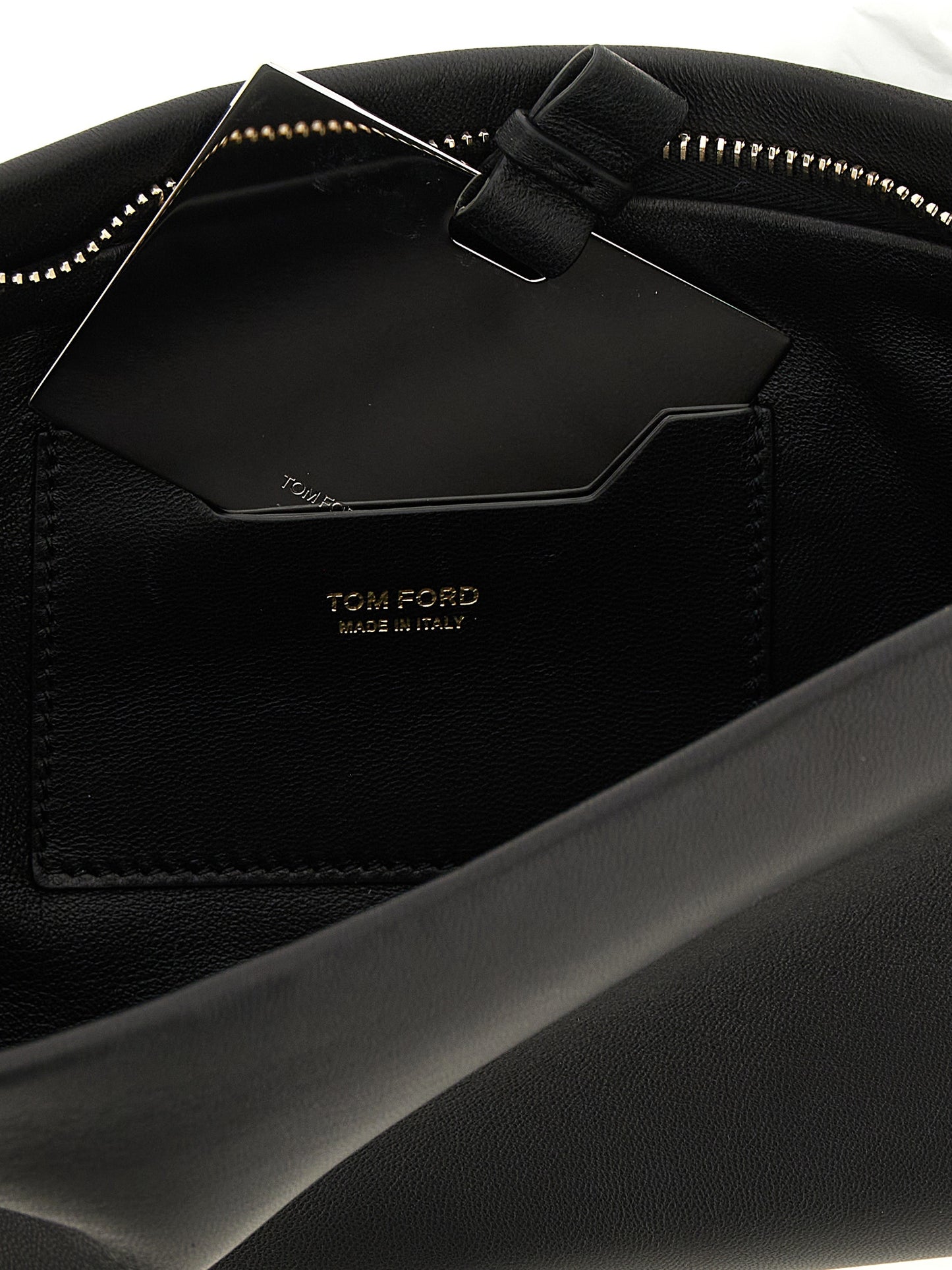 Evening Clutch Handbag by Tom Ford for women in lamb leather black & gold features a sculptural silhouette with a secure zipper, ample , and versatile for a sculptural finish.