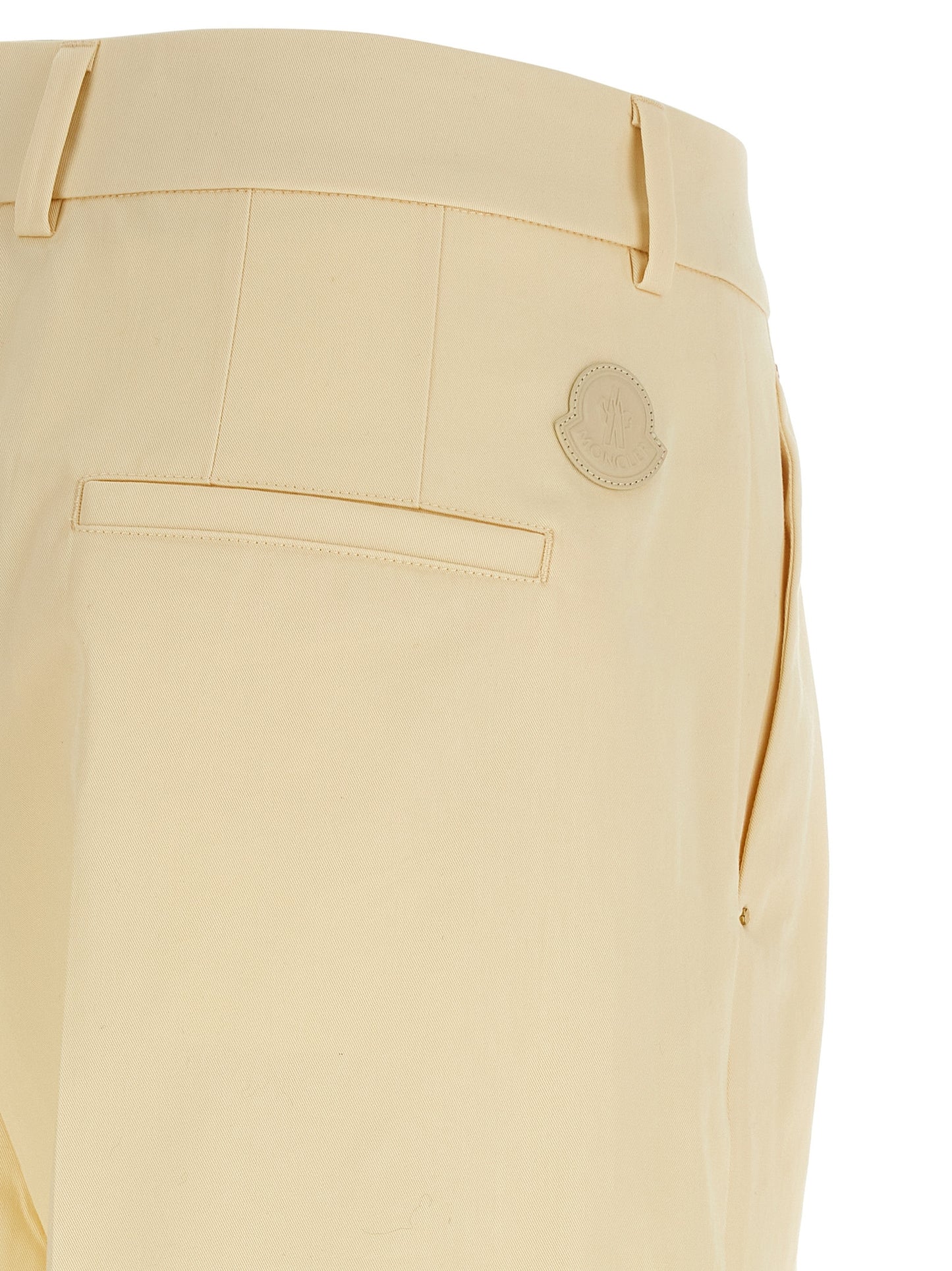 Trousers by Moncler for women in leather & cotton beige presents a smart silhouette, meticulously detailed with a smart straight-leg & wide, a smart long, and a smart .