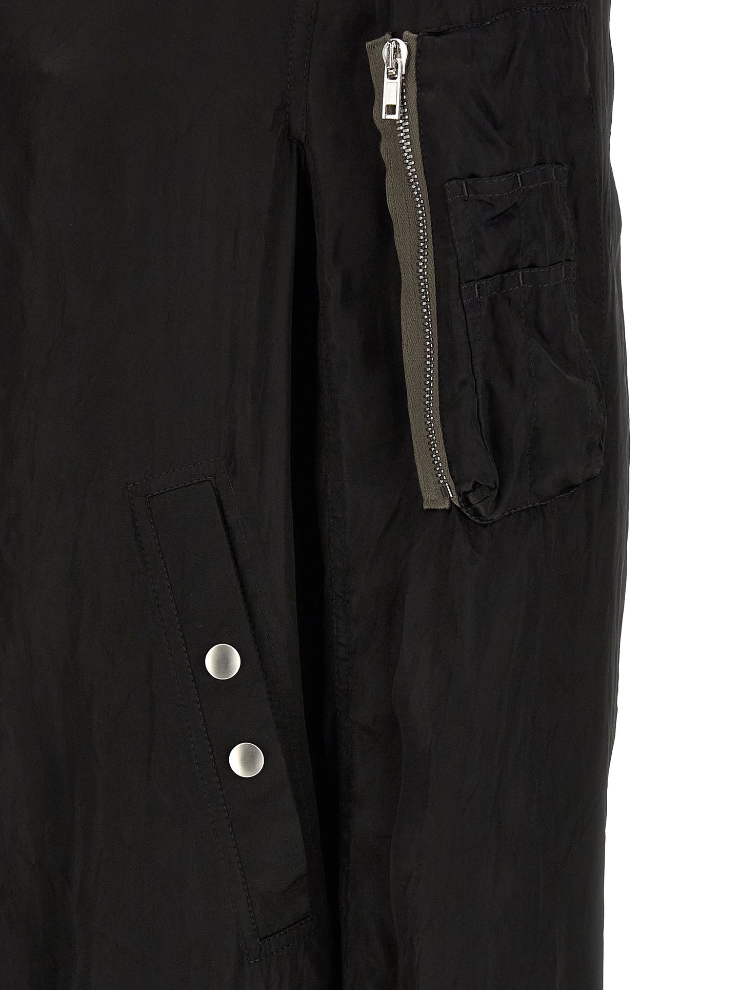 Bomber Jacket by Rick Owens for men in nylon & cupro black & copper showcases a bohemian silhouette, artfully detailed with a bohemian and signature pockets & insulated for a truly bohemian finish.