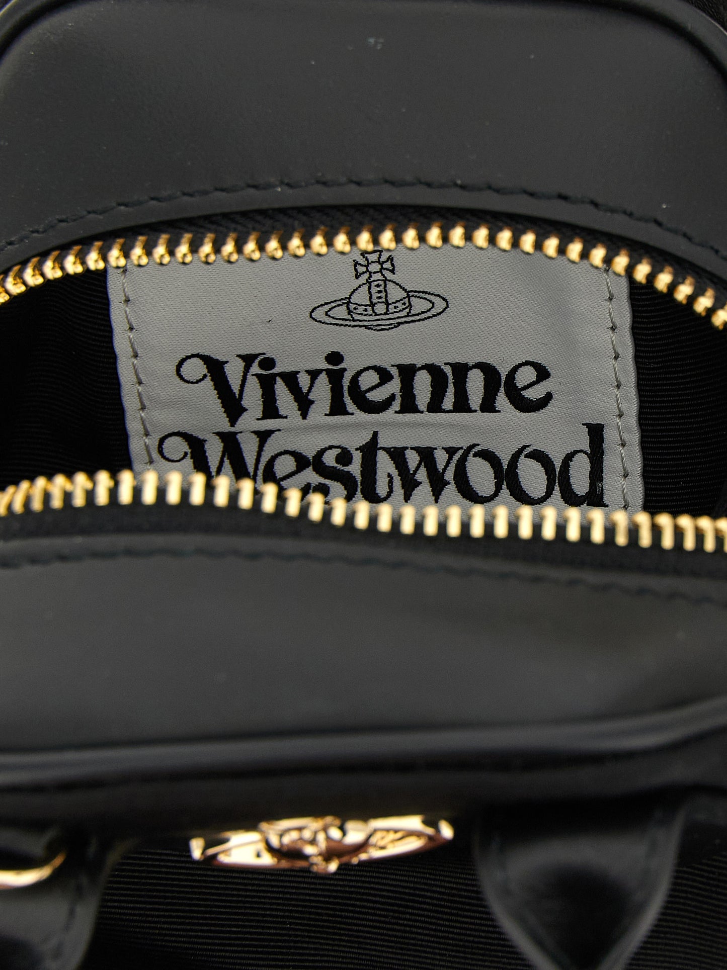 Mini Handbag by Vivienne Westwood for women in viscose & rubber black features a signature silhouette, showcasing a secure zipper and signature with versatile shoulder-strap, adjustable-strap & handle for a sophisticated look.