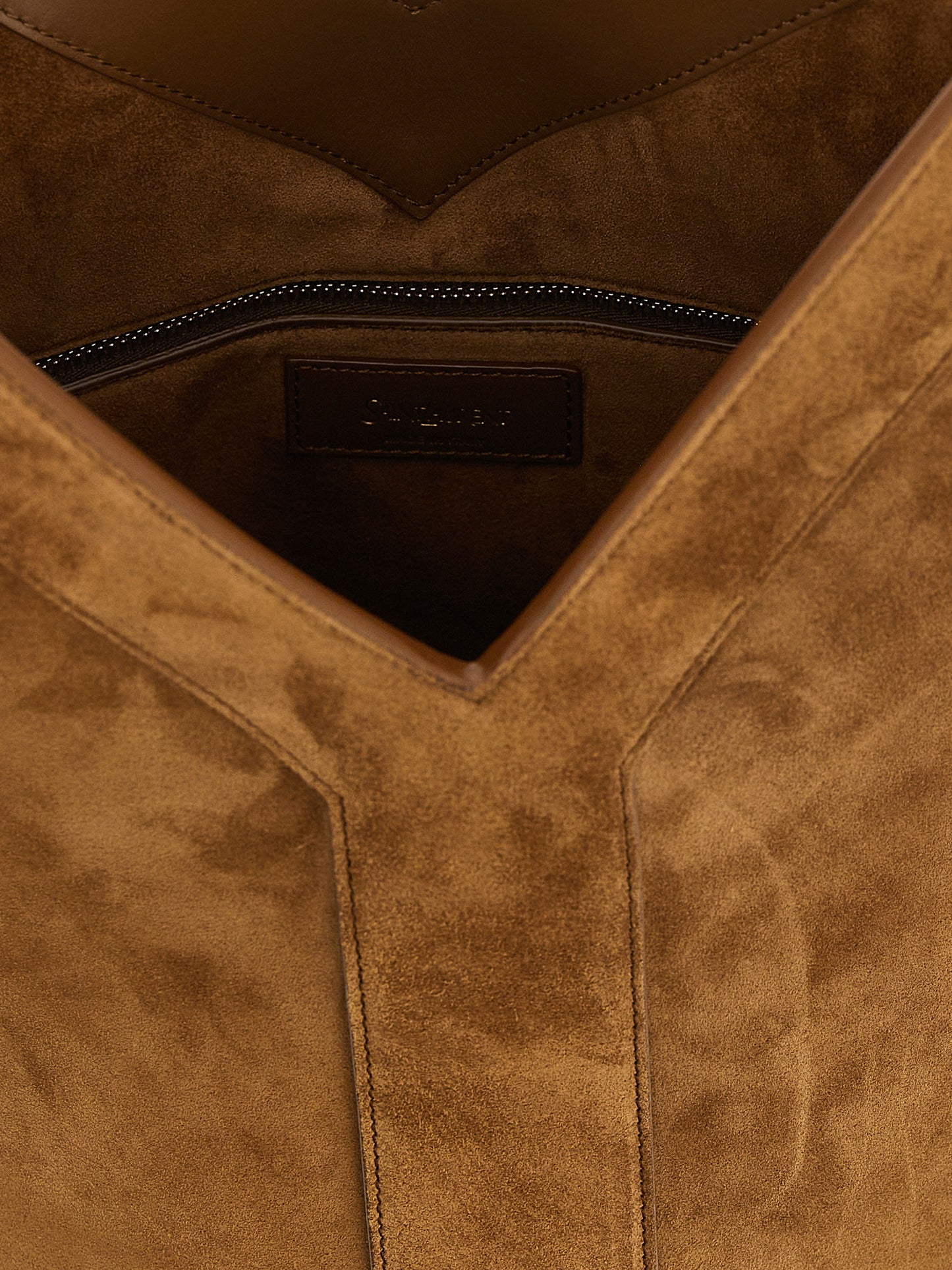 Shoulder Bucket Bag by Saint Laurent for women in bos taurus suede calfskin leather brown features a effortless chic silhouette with a secure , ample , and versatile shoulder-strap, handle & adjustable-strap for a effortless chic finish.
