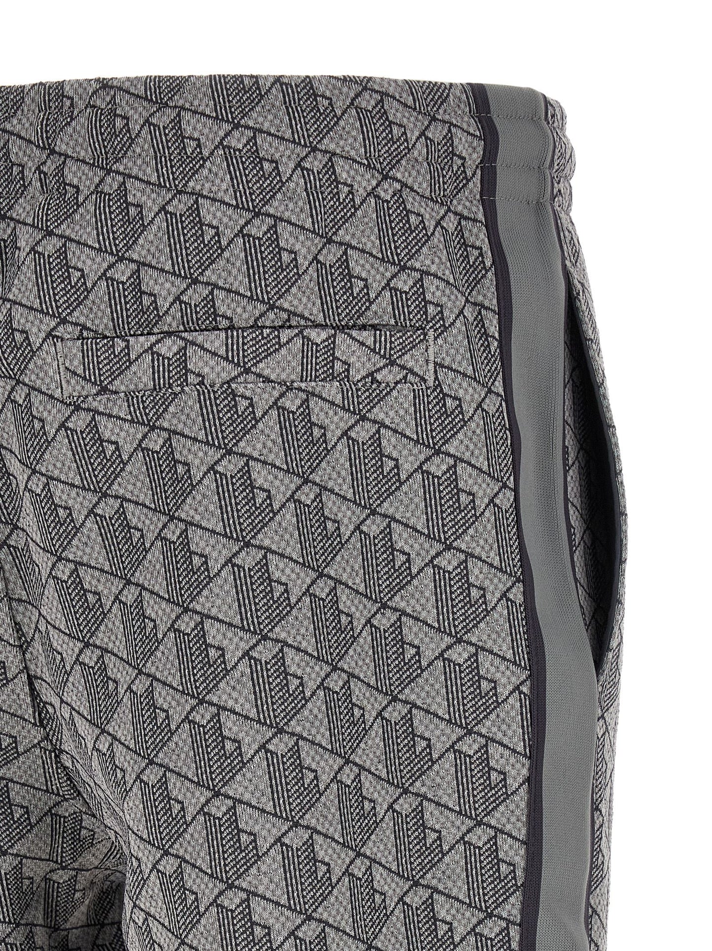 Joggers by Lacoste for men in polyamide polyester & cotton gray, jacquard & monogram presents a refined pantology silhouette, artfully defined by a refined pantology straight-leg, long, and a sophisticated .