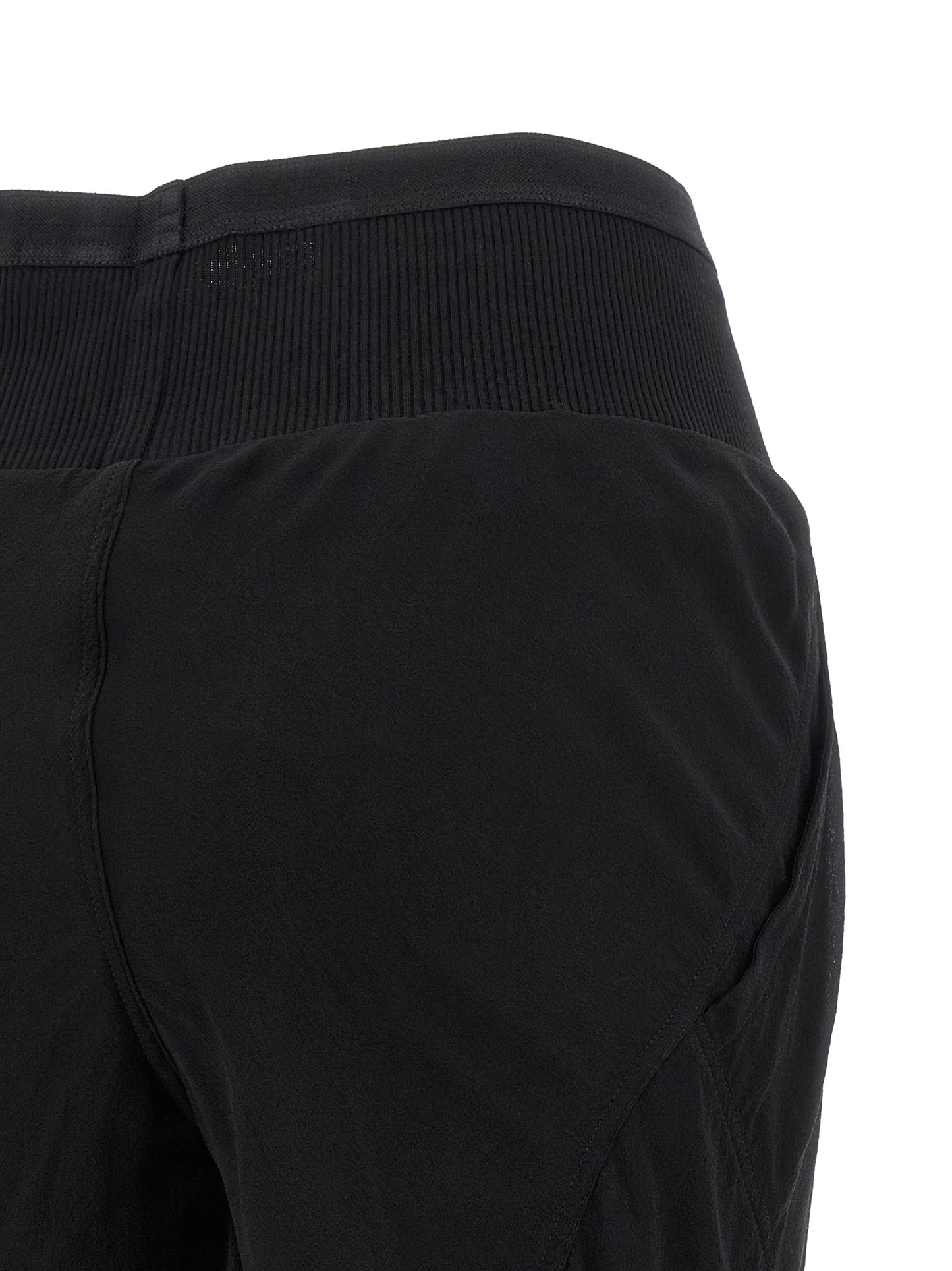 Trousers by Rick Owens for women in silk black & transparent features a artisanal silhouette, showcasing a sophisticated flared with a long and for a artisanal finish.
