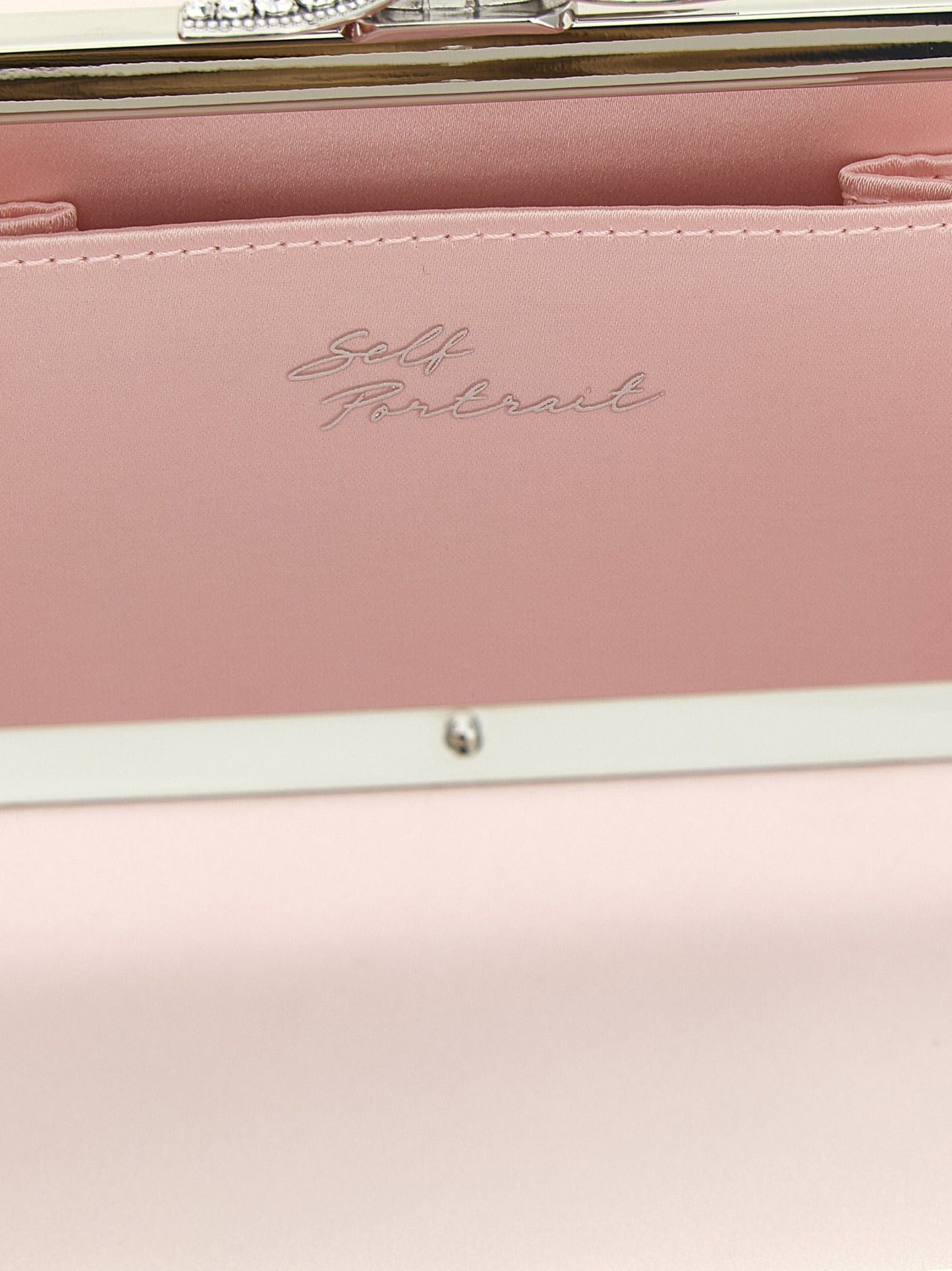 Shoulder Clutch Handbag by Self-Portrait for women in polyester polyurethane satin multicolor & pink showcases a sculptural silhouette, featuring a secure magnetic, ample , and versatile shoulder-strap for a sculptural finish.