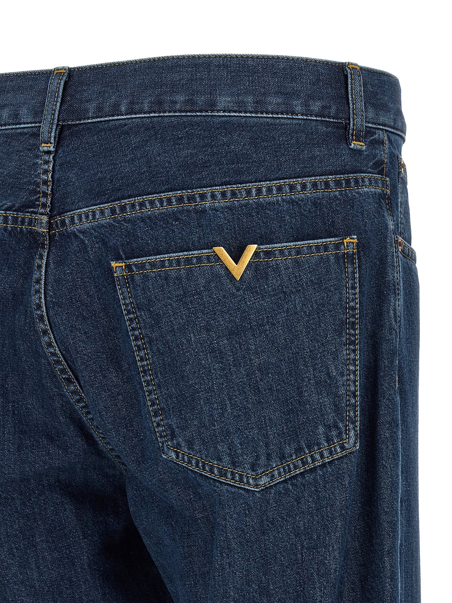 Jeans by Valentino Garavani for men in denim cotton blue & gold presents a tailored silhouette, showcasing a tailored straight-leg and long cut with a refined for a truly tailored aesthetic.