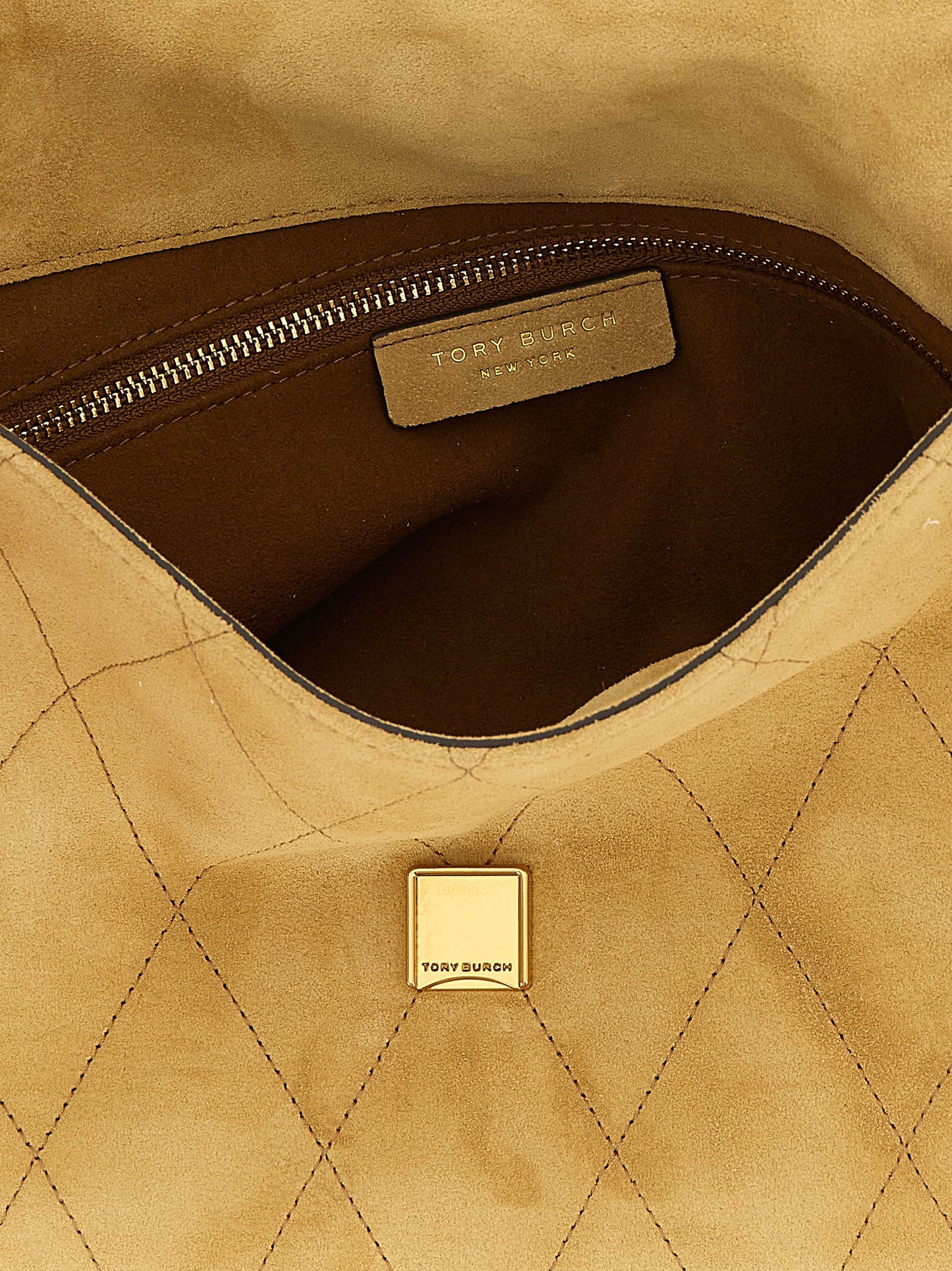 Medium Shoulder Flap Bag by Tory Burch for women in suede calfskin leather beige features an effortlessly chic silhouette with a secure flap & magnetic, ample , and versatile shoulder-strap for effortlessly chic everyday luxury.