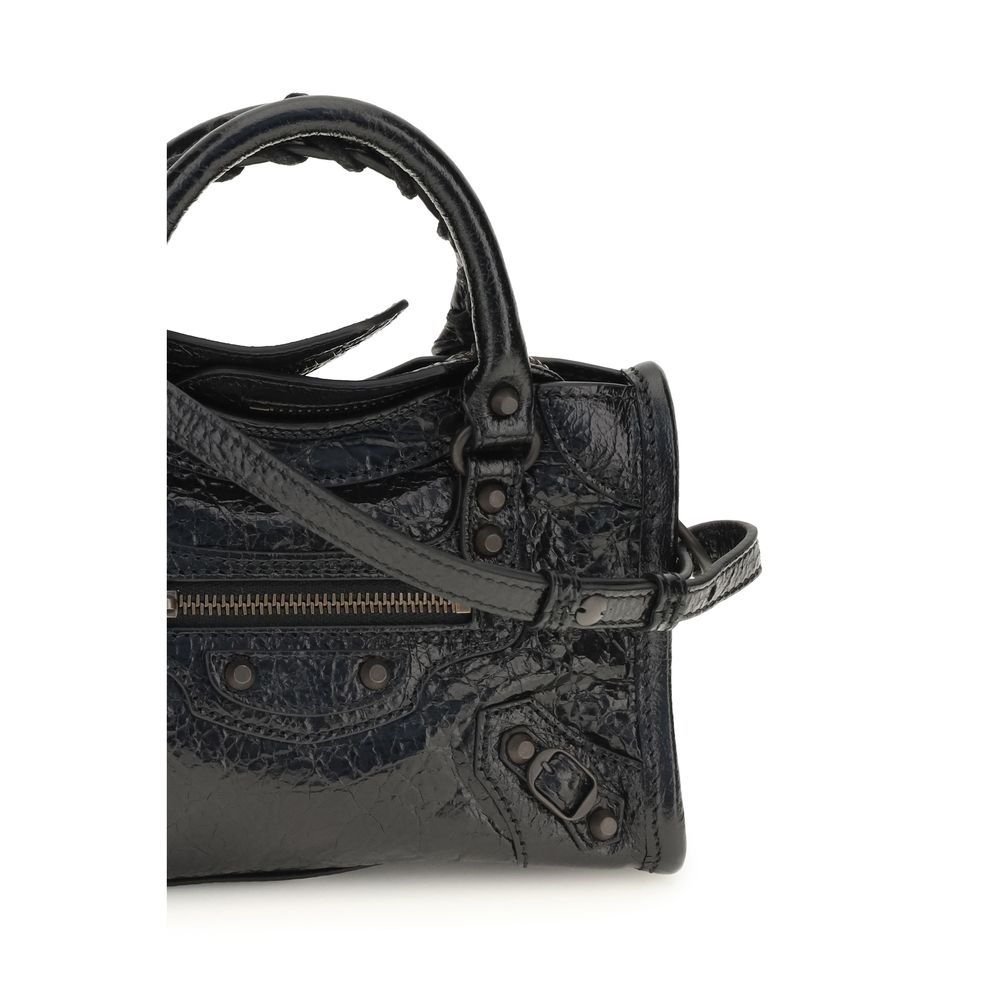 Compact Handbag by Balenciaga for women in lambskin leather black & signature features an refined silhouette, showcasing a secure zipper, ample , and versatile shoulder-strap, adjustable-strap & handle for a sophisticated refined aesthetic.