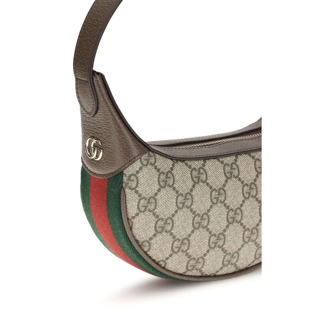 Small Shoulder Handbag by Gucci for women in leather beige, gold, signature, monogram & striped features a signature silhouette, showcasing a secure zipper and signature cardholder with versatile shoulder-strap & handle for a sophisticated look.