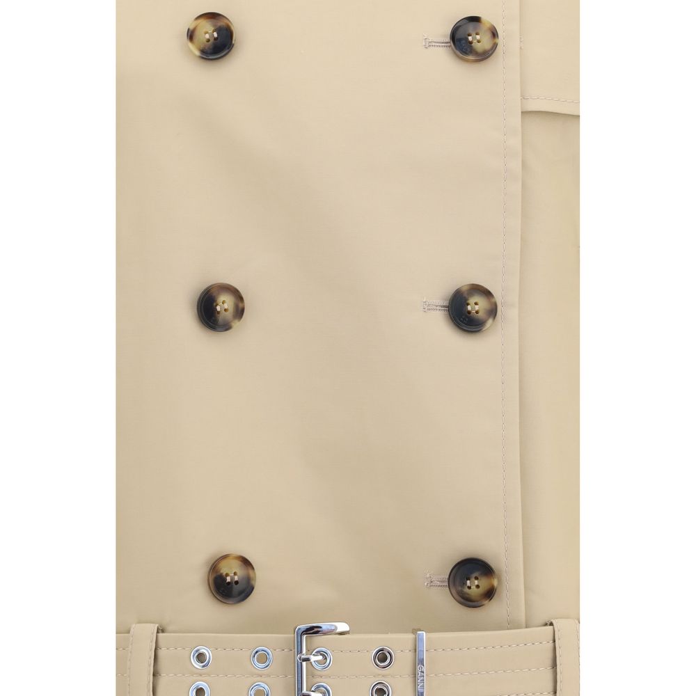 Trench Coat by Ganni for women in cotton beige presents an sculptural silhouette, artfully detailed with a sculptural and functional lightweight for a truly sculptural finish.