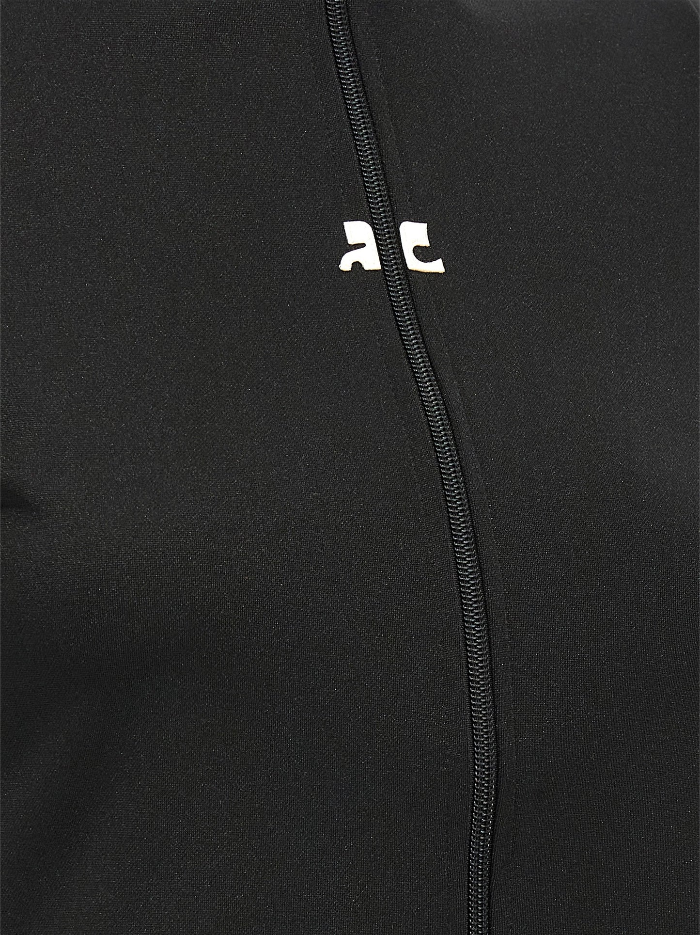 Activewear T-Shirt by Courrèges for women in polyester black features an athletic silhouette with sleeves and a neckline, enhanced by high-performance seamless.