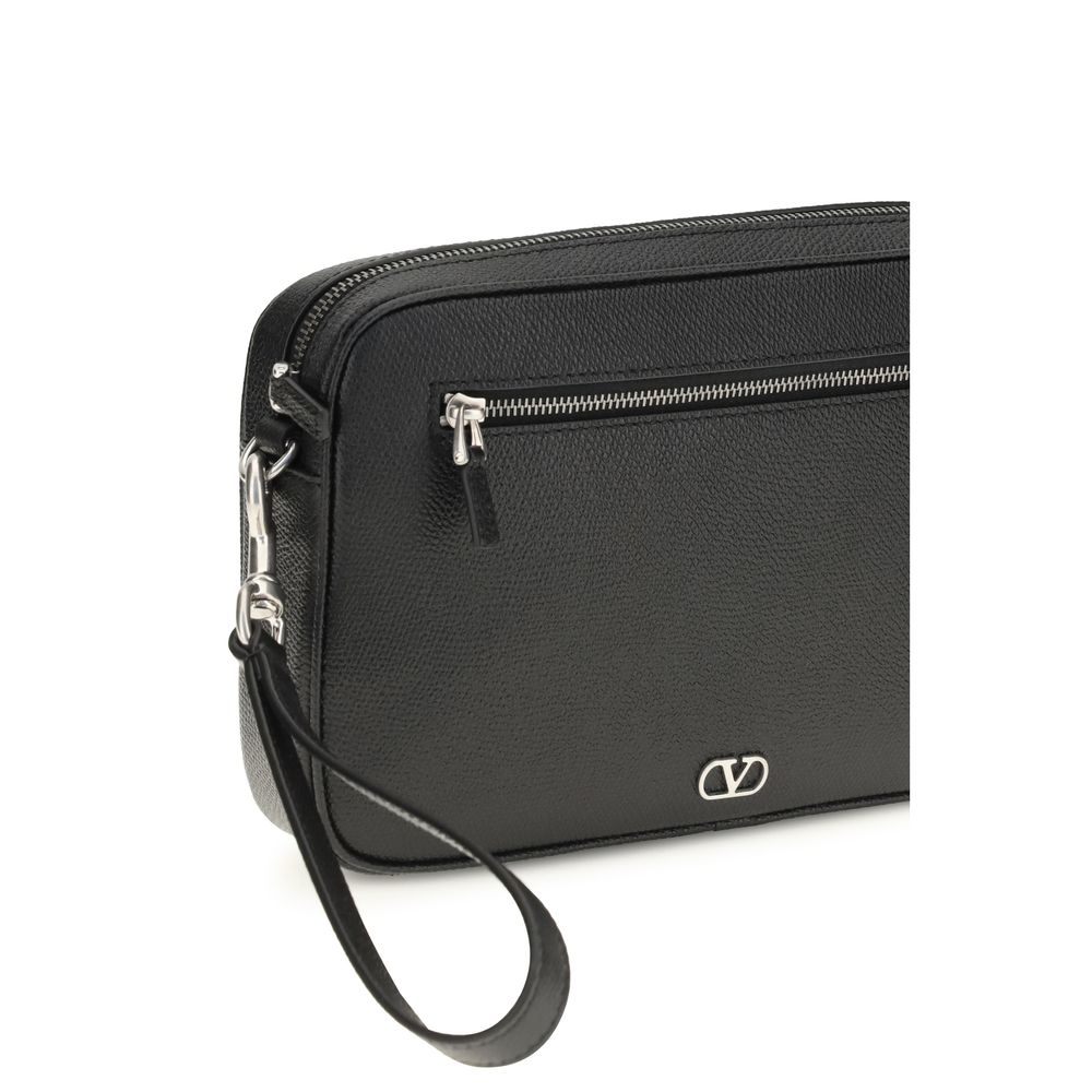 Pouch Handbag by Valentino Garavani for unisex in bos taurus calf leather black & signature features a contemporary silhouette, showcasing a secure zipper, ample , and contemporary wristlet for a sophisticated look.