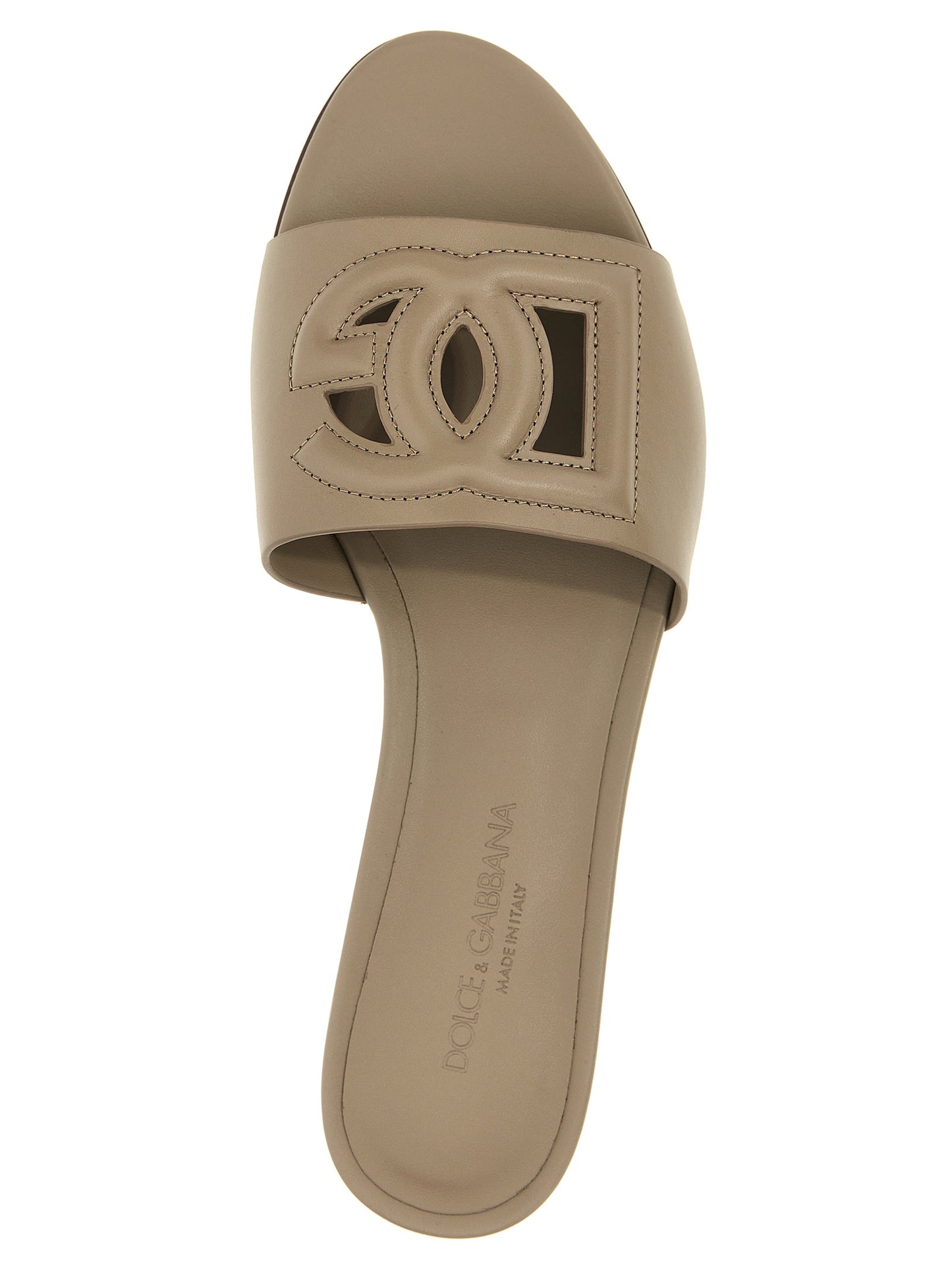 Sliders Flat Shoes by Dolce & Gabbana for women in calfskin leather gray showcases a dynamic silhouette, artfully capturing Women's Calfskin Leather Sliders Flat Shoes through its distinctive and elegant .