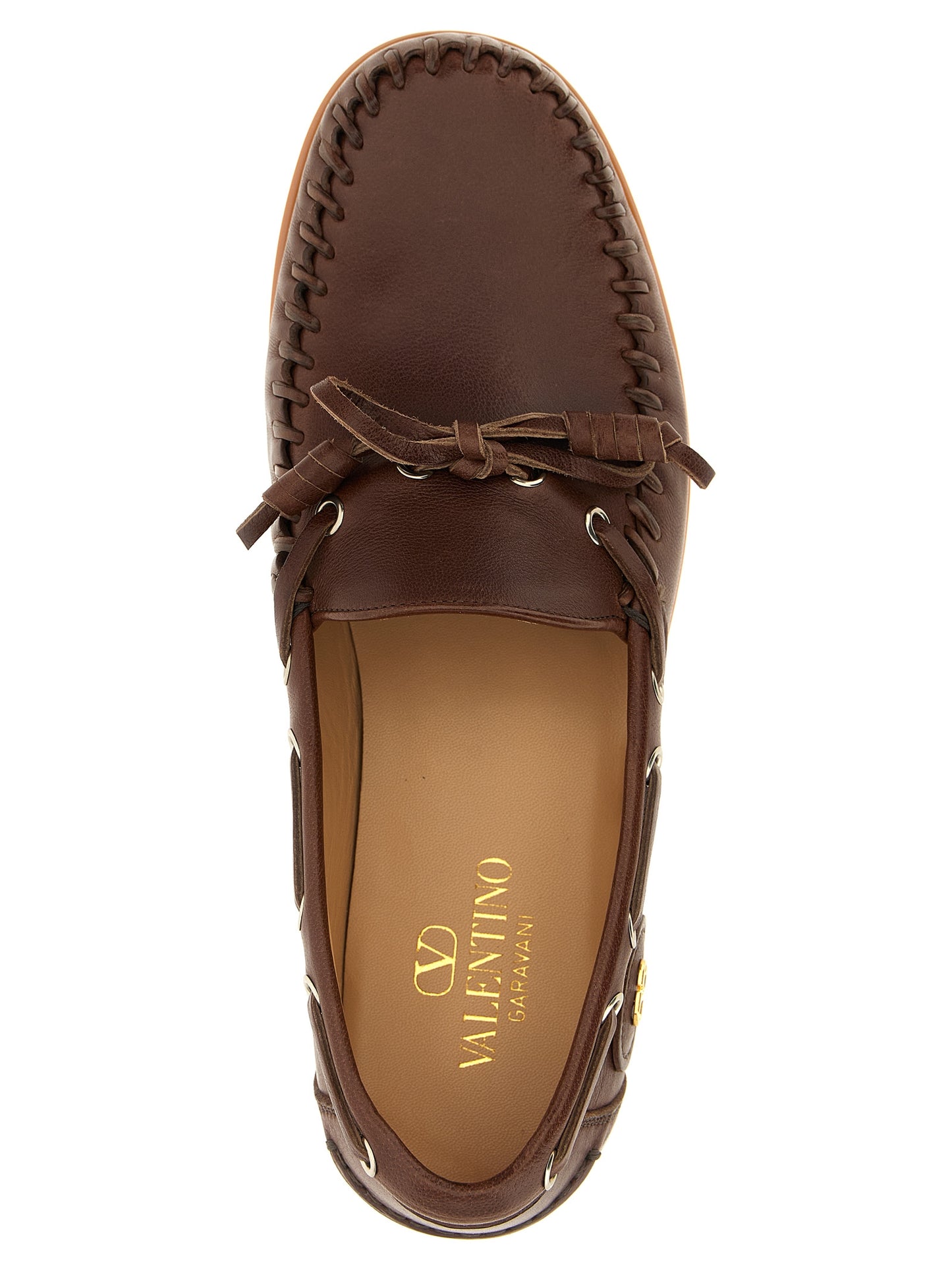 Boat Flat Shoes by Valentino Garavani for men in buffalo leather brown & signature presents a impeccable silhouette as V Logo Men's Buffalo Leather Boat Flat Shoes, artfully designed with a and a impeccable for a refined, upscale finish.