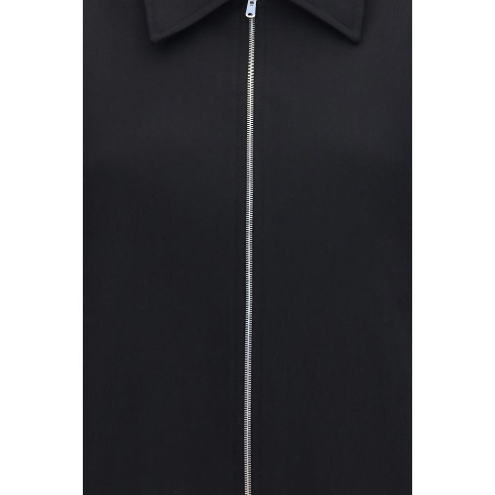 Overcoat by Our Legacy for women in merino wool black showcases a architectural silhouette, artfully detailed with a distinctive and functional pockets for a architectural finish.