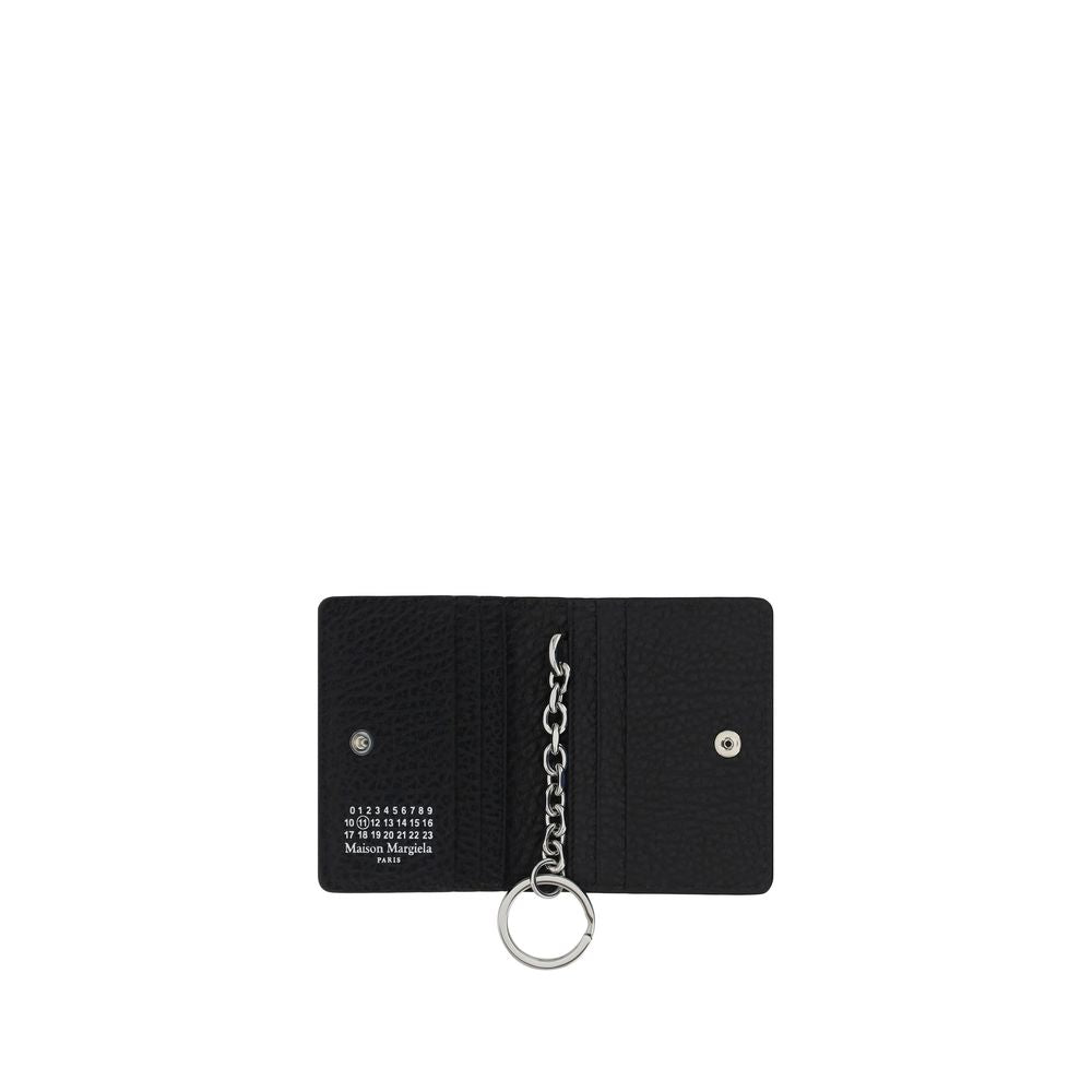 This Keychain by Maison Margiela for women in wool and black, silver & print showcases a couture-inspired aesthetic, meticulously highlighting the and with a finish.