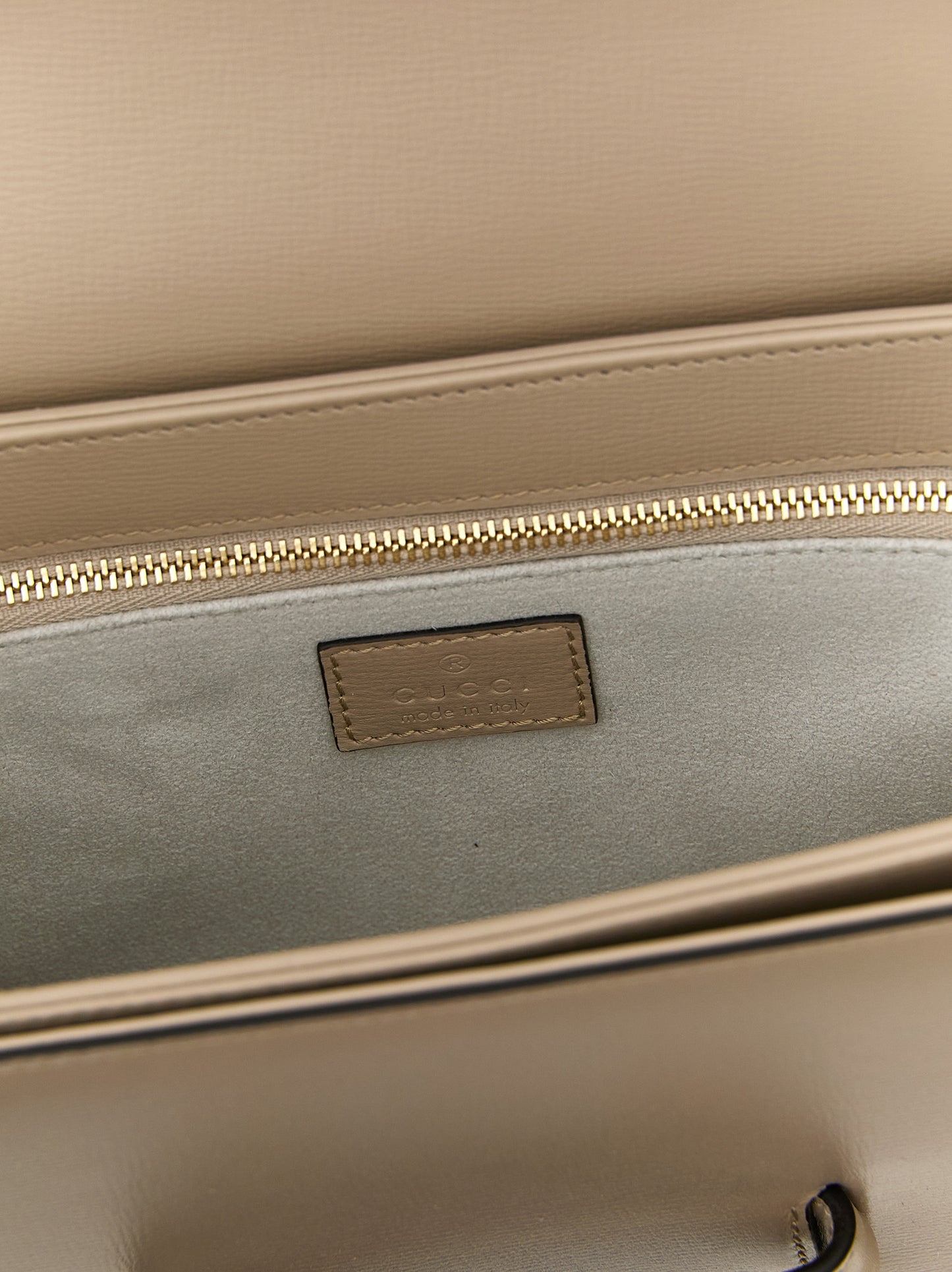 Medium Shoulder Flap Bag by Gucci for women in calfskin leather beige & signature features a effortless sophistication silhouette, secured by a flap with ample and versatile shoulder-strap & adjustable-strap for a effortless sophistication finish.