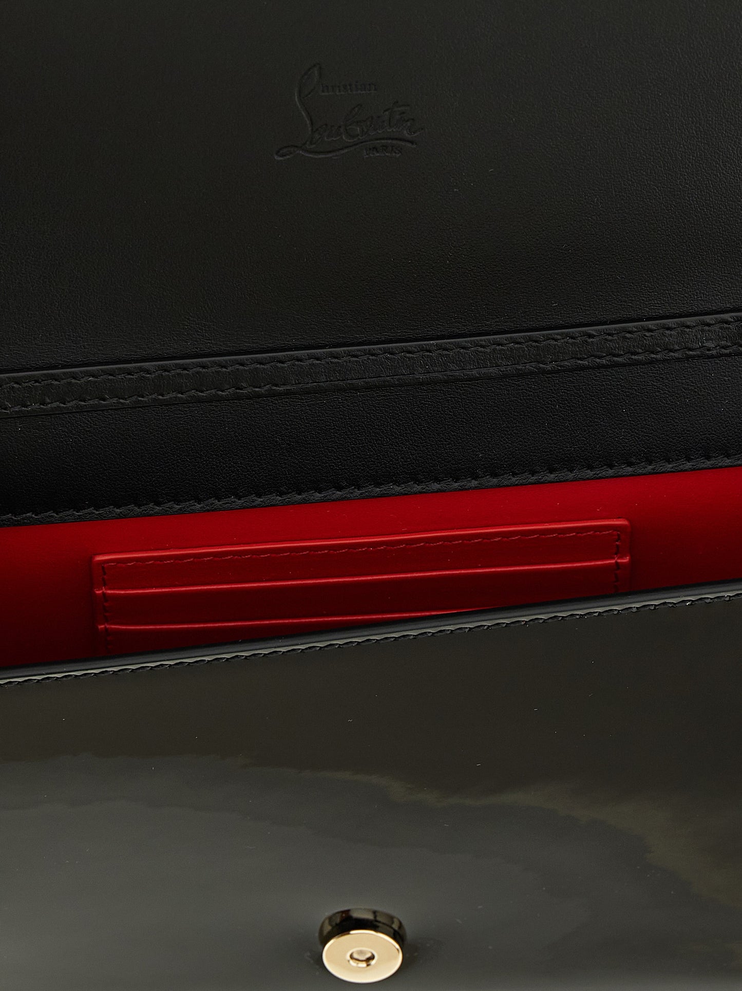 Shoulder Evening Flap Clutch Handbag by Christian Louboutin for women in calfskin leather black features a statuesque silhouette, showcasing a secure flap & magnetic and organized with versatile shoulder-strap for statuesque evening wear.