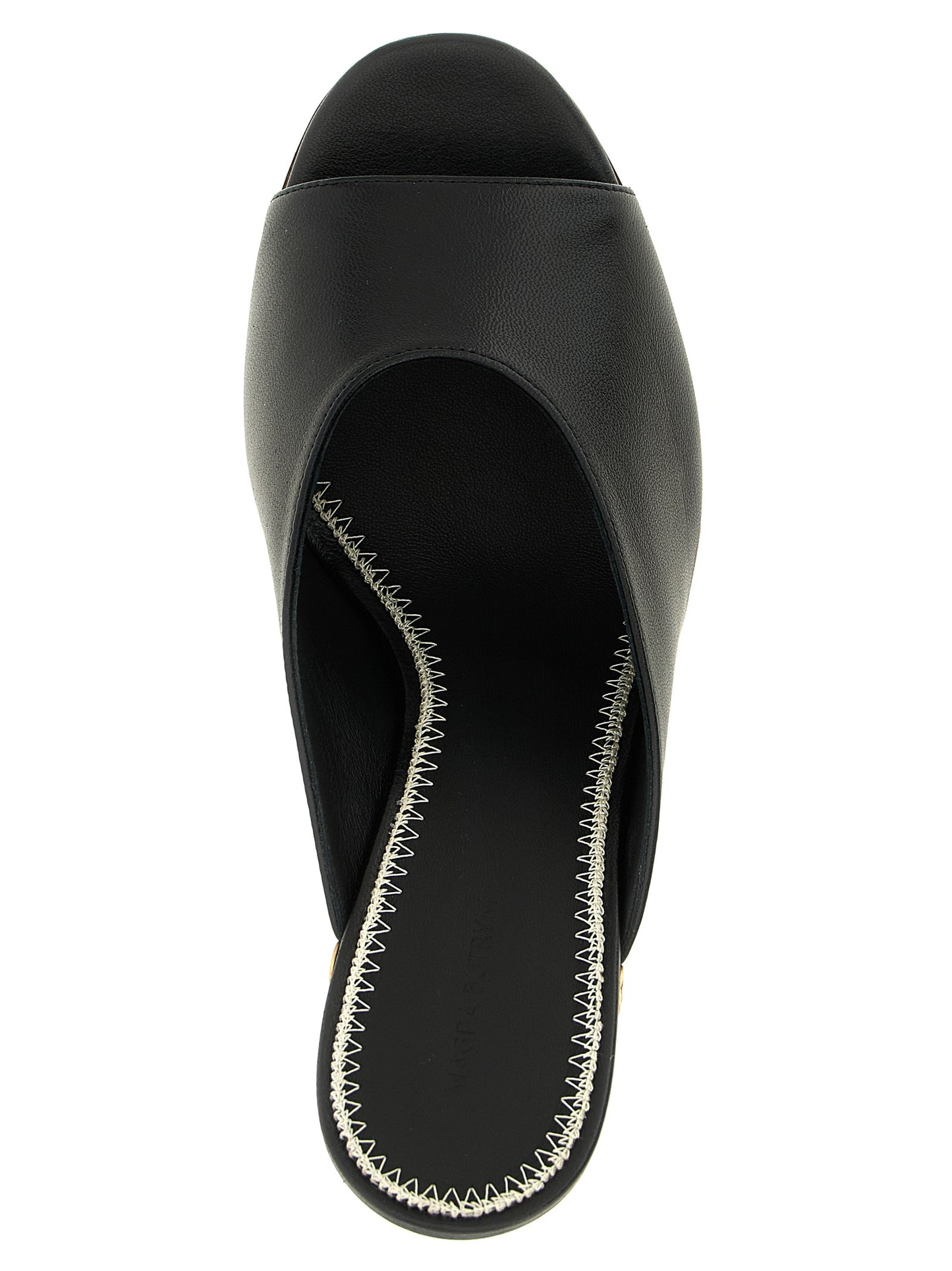 Wedge Mules Sandals by Magda Butrym for women in calfskin leather black showcases a sculptural silhouette as Women's Calfskin Leather Wedge Mules Sandals, defined by a sculptural wedge and sculptural open toe style for a sculptural look.