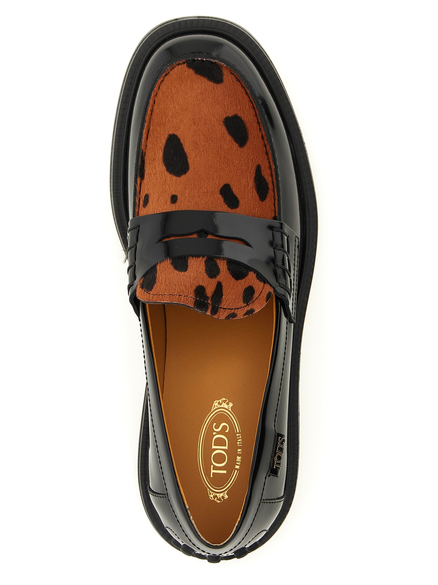 This Flat Moccasin Moccasins Loafer Slip-On Shoes by Tod's for women in calfskin leather black, leopard-print, signature & print features an exquisite silhouette from the Gommini Pony Women's Calfskin Leather Flat Moccasin Moccasins Loafer Slip-On Shoes collection, defined by a sophisticated flat and elegant .
