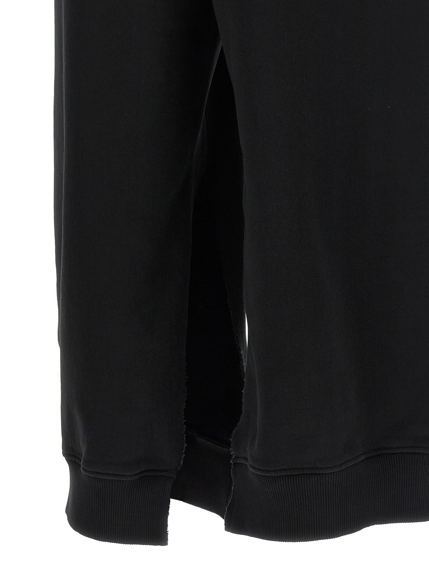 Joggers by MM6 Maison Margiela for women in cotton black, white & signature features an sophisticated and athletic & relaxed-fit with a precise long, creating a sophisticated and sophisticated silhouette.