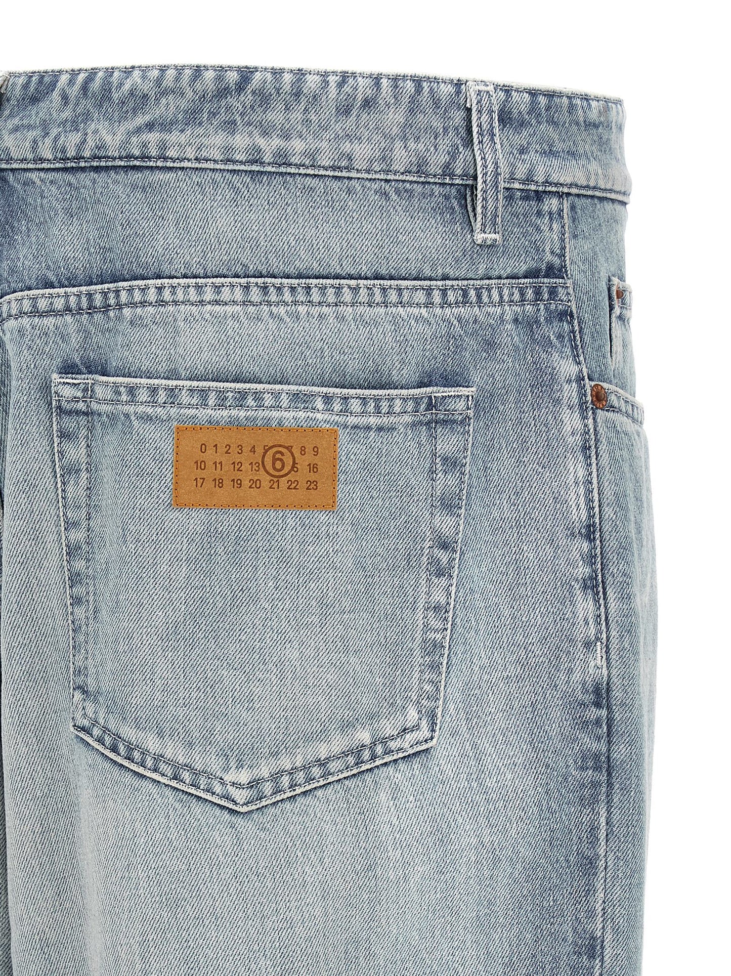 Jeans by MM6 Maison Margiela for men in denim cotton light-blue, white & signature features an refined tailoring silhouette, showcasing a premium straight-leg & relaxed-fit with a and long cut for a refined tailoring look.