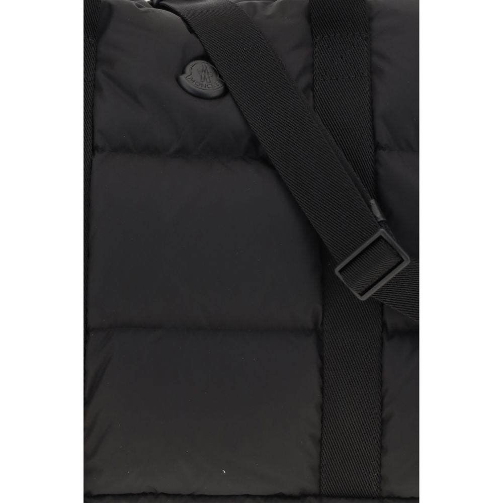 Travel Shoulder Bag by Moncler for men in polyester black & signature features a effortless sophistication silhouette, secured by a zipper with ample and versatile shoulder-strap, adjustable-strap, detachable-strap & handle for a effortless sophistication finish.