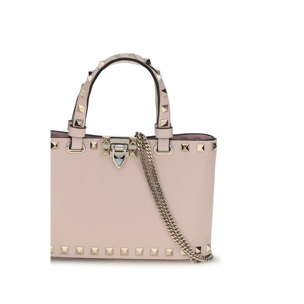 This Mini Crossbody Travel Satchel Handbag by Valentino Garavani for women in bos taurus calfskin leather and multicolor & signature presents a sculptural silhouette featuring a secure hook, ample , and versatile crossbody-strap & handle for a sculptural finish.