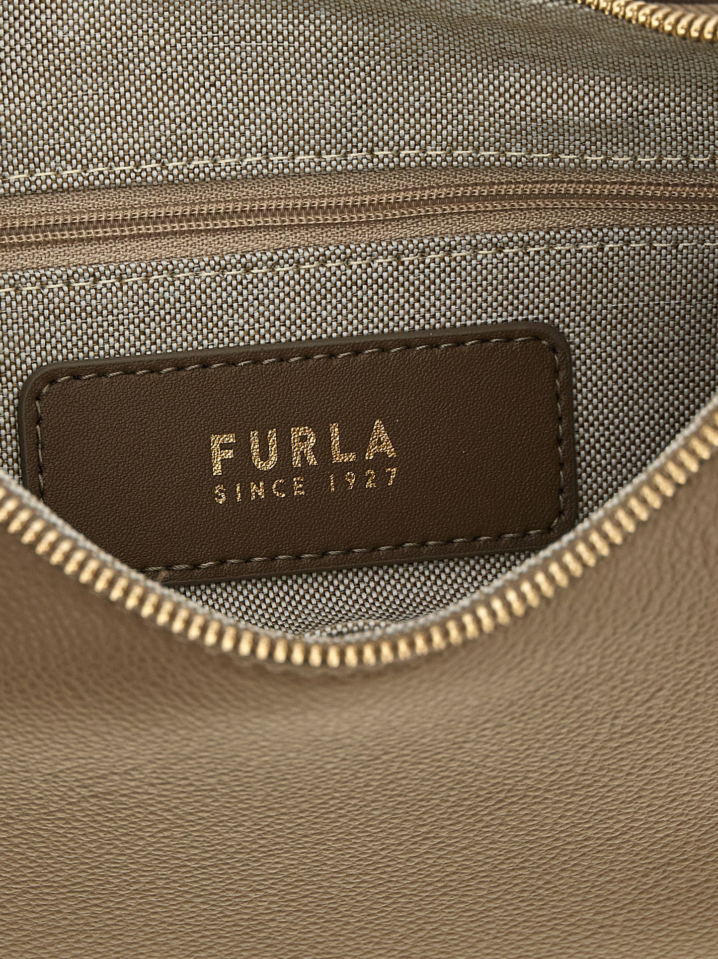 Shoulder Crescent Bag by Furla for women in calfskin leather beige & gold features an effortlessly chic silhouette with a secure , ample , and versatile shoulder-strap, adjustable-strap & handle for effortlessly chic everyday luxury.