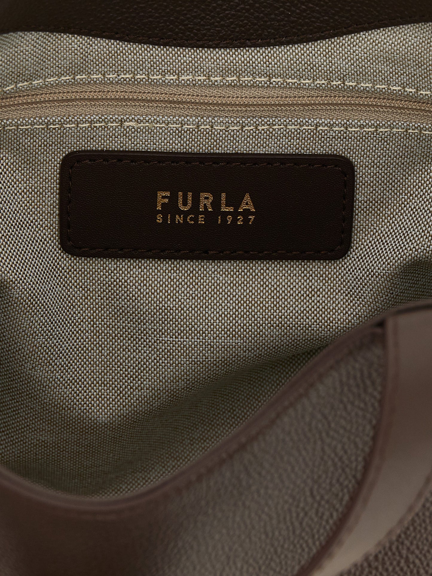 Tote Bag by Furla for women in calfskin leather brown & gold features an jet-set-ready silhouette, showcasing the Goccia Calfskin Leather Tote Bag design with a secure , ample , and versatile handle & adjustable-strap.