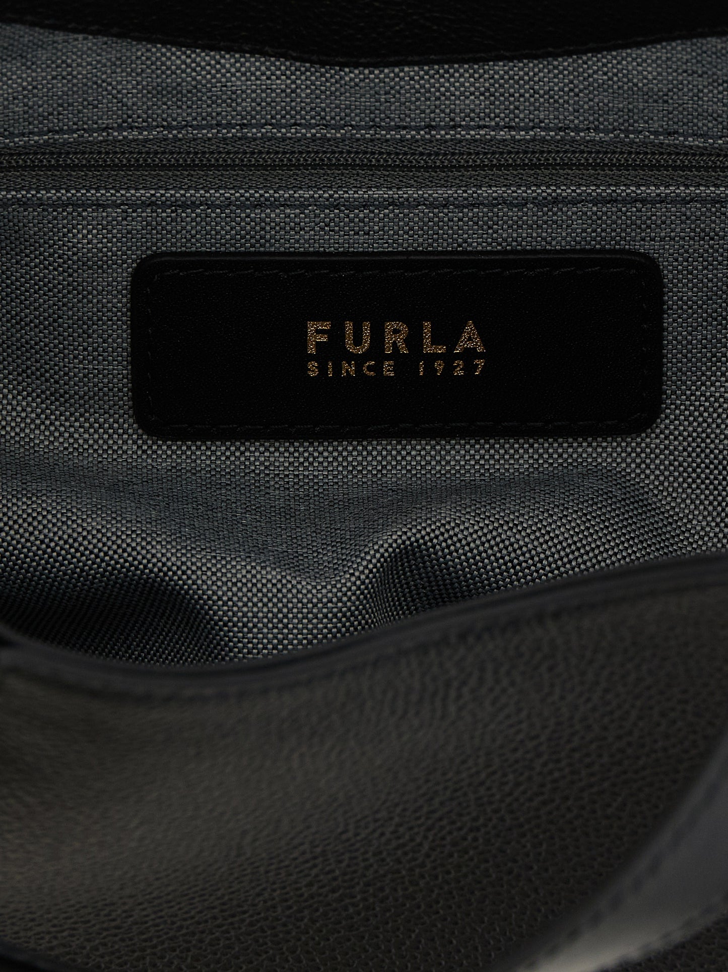 Tote Bag by Furla for women in calfskin leather black & gold features a jet-set Goccia Calfskin Leather Tote Bag design, complete with a secure , ample , and versatile shoulder-strap, handle & adjustable-strap for a jet-set look.