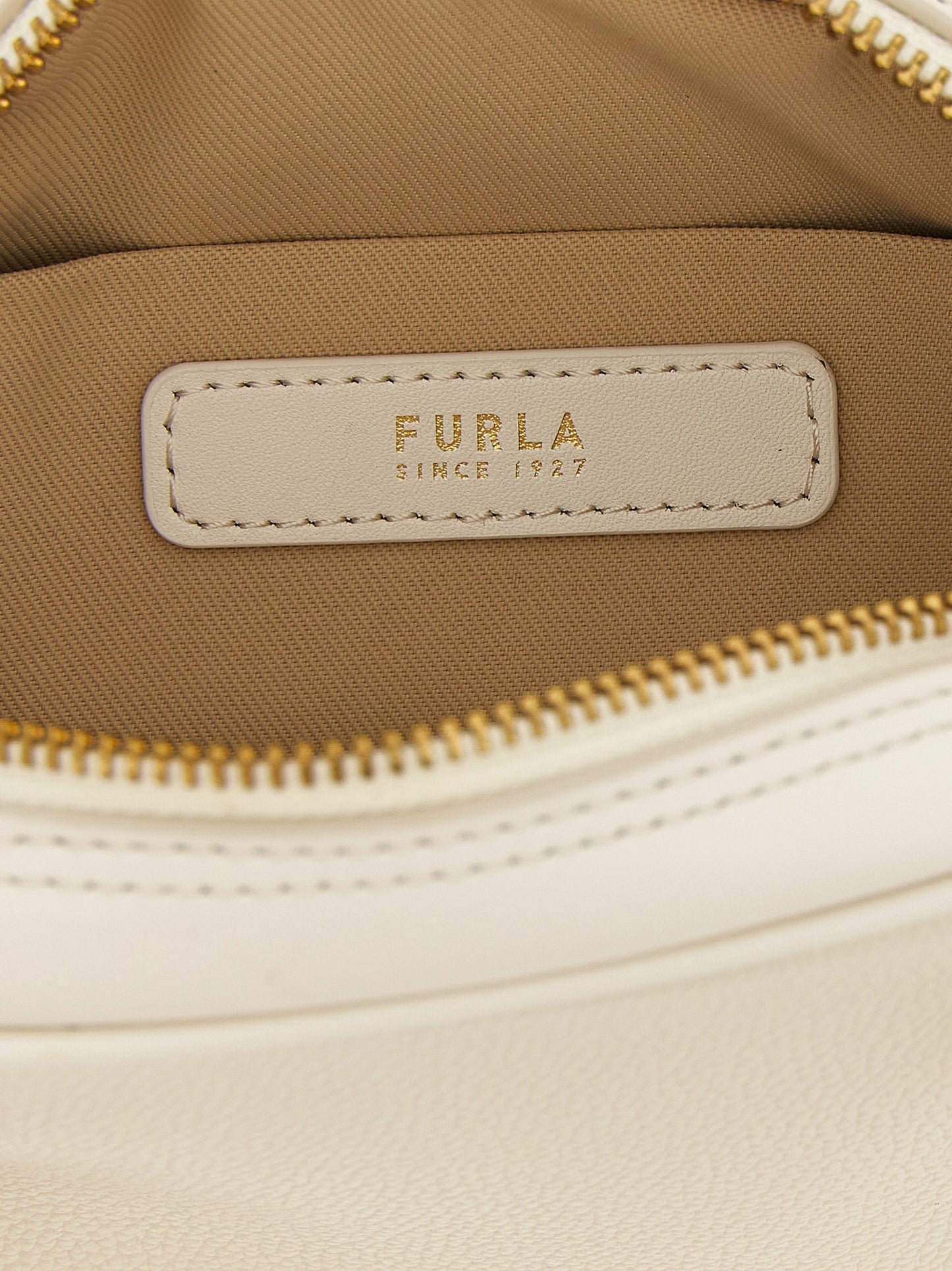 Dome Handbag by Furla for women in calfskin leather cream, gold & white features a ornamental silhouette, showcasing a secure zipper, ample , and ornamental shoulder-strap, adjustable-strap & handle for a sophisticated look.