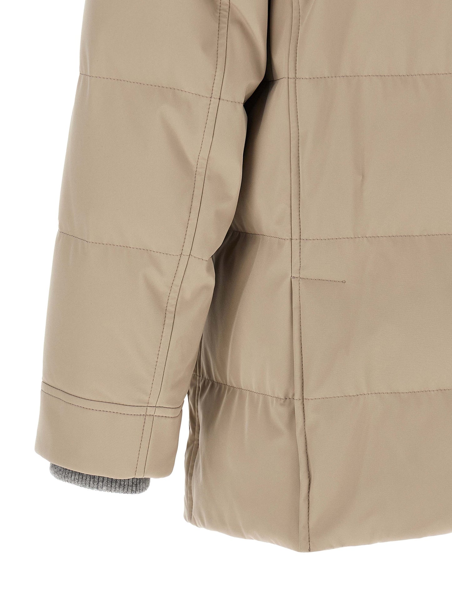This Hooded Parka by Brunello Cucinelli for men in polyamide beige, gray & silver presents a enveloping silhouette, meticulously detailed with pockets, hooded & insulated and a enveloping .