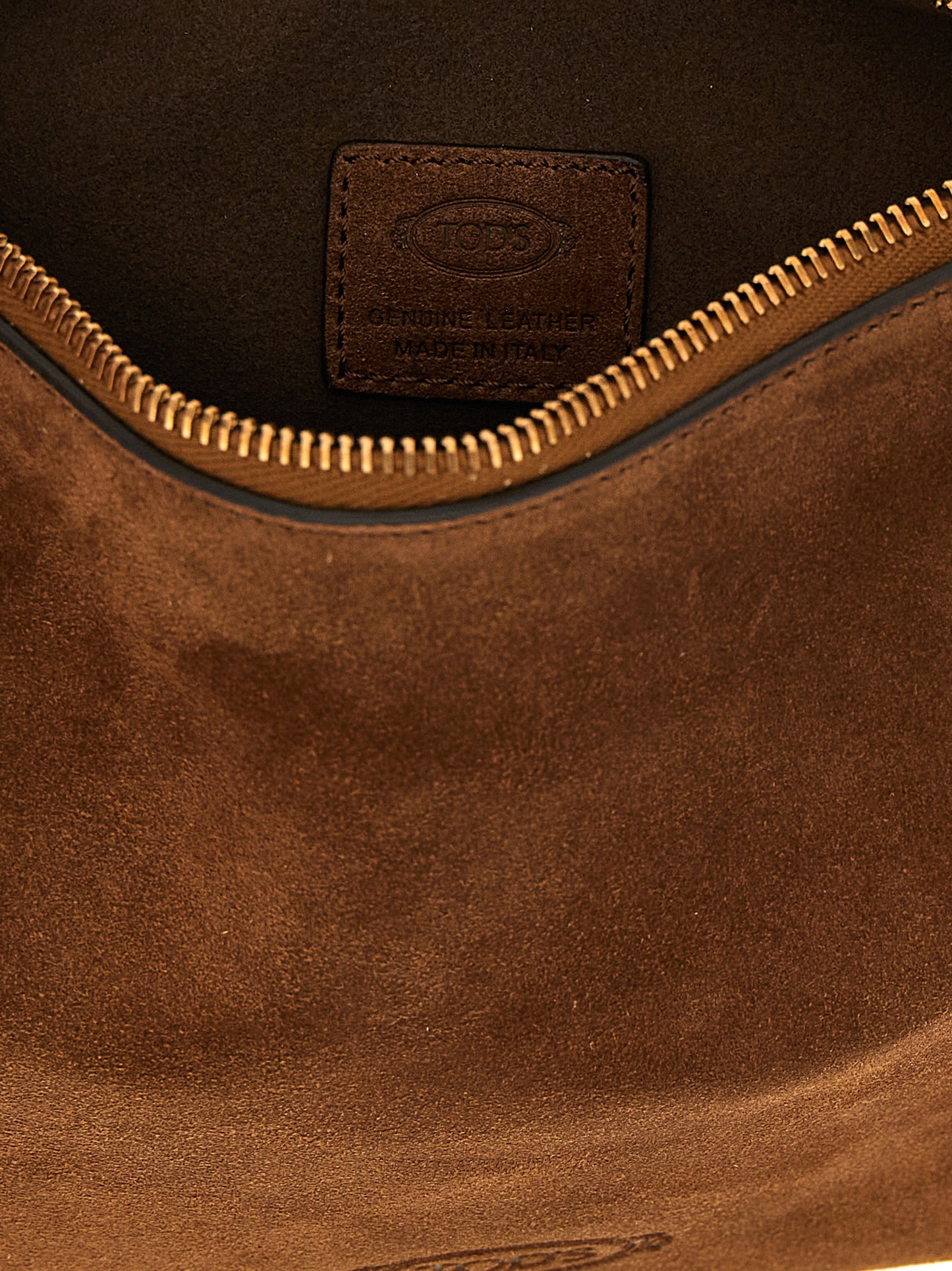 Mini Shoulder Hobo Bag by Tod's for women in calfskin leather brown & signature features a effortless chic silhouette with a secure zipper & clasp, ample , and versatile shoulder-strap & adjustable-strap for a effortless chic finish.