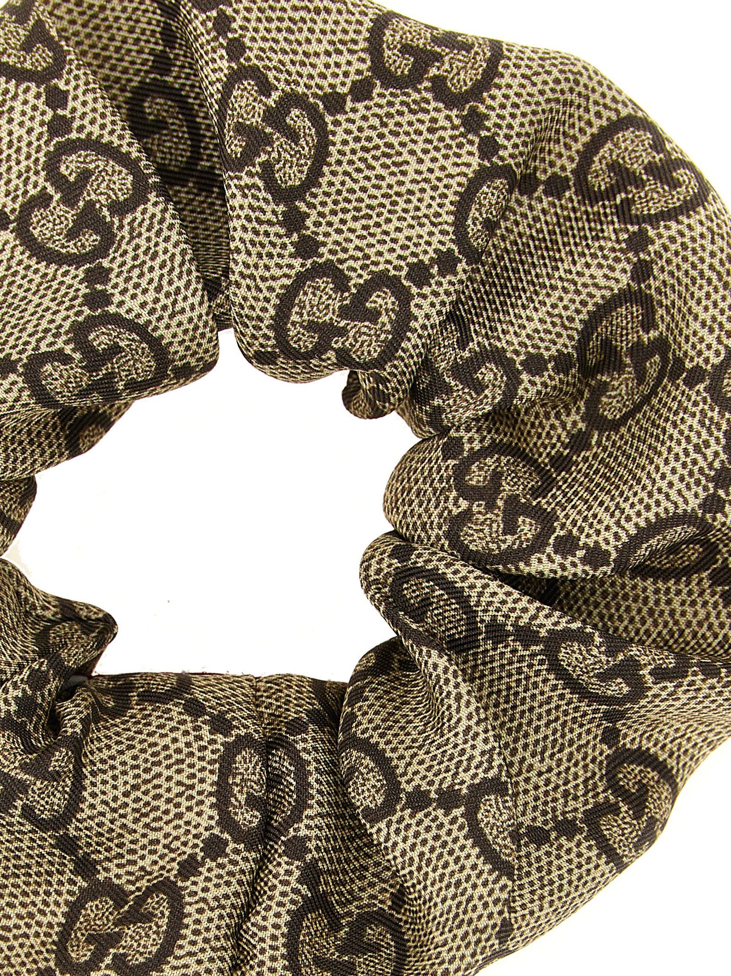 Ponytail Holder by Gucci for women in silk cashmere & sequins beige, brown, multicolor, red, white, patterned & monogram features a regal finish, perfectly showcasing the sophisticated design of the Gg Silk Ponytail Holder.