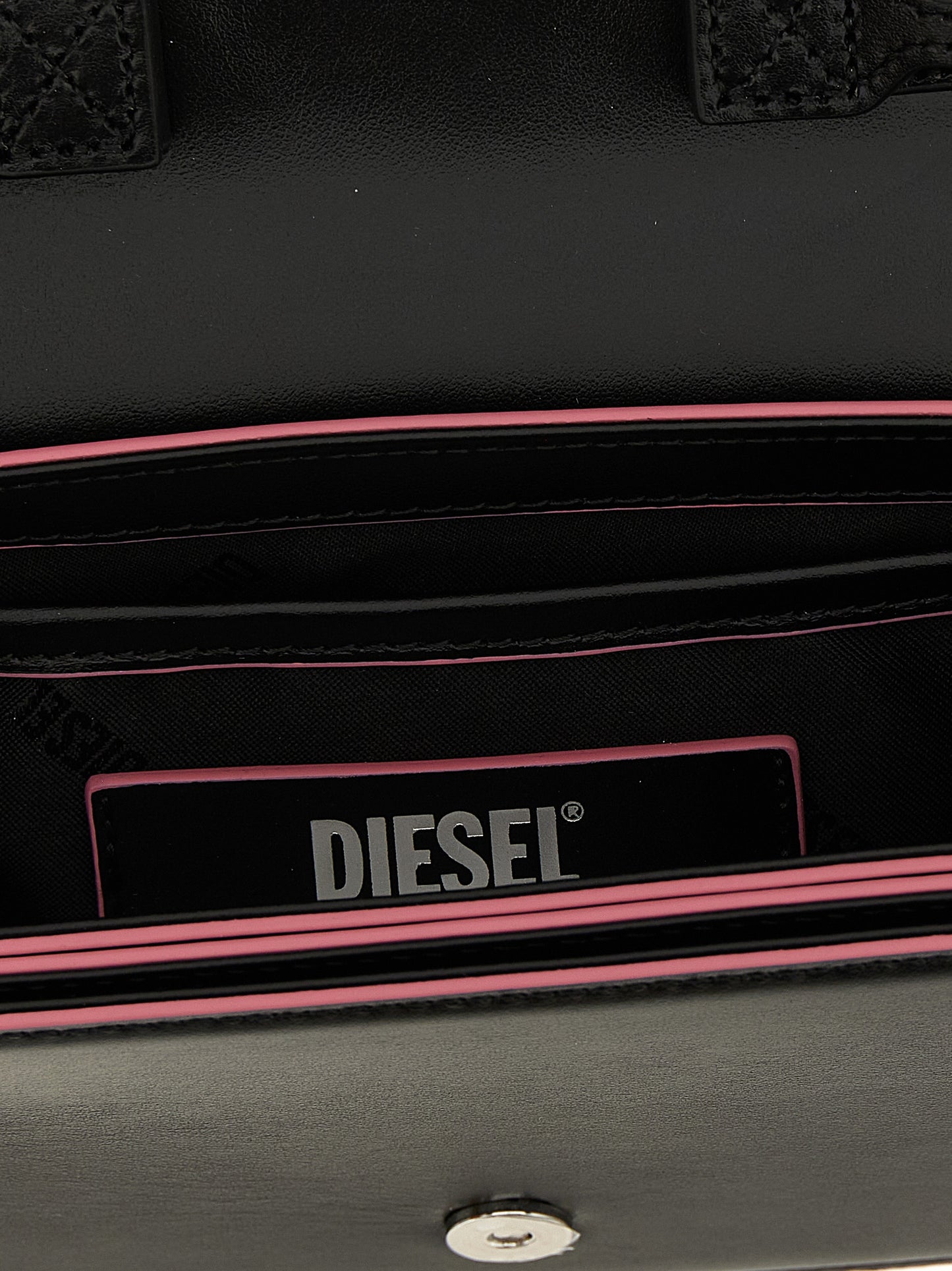 Compact Shoulder Oval Bag by Diesel for women in metal multicolor showcases a statuesque silhouette, artfully detailed with a secure , organized , and versatile shoulder-strap, handle & adjustable-strap for a statuesque look.