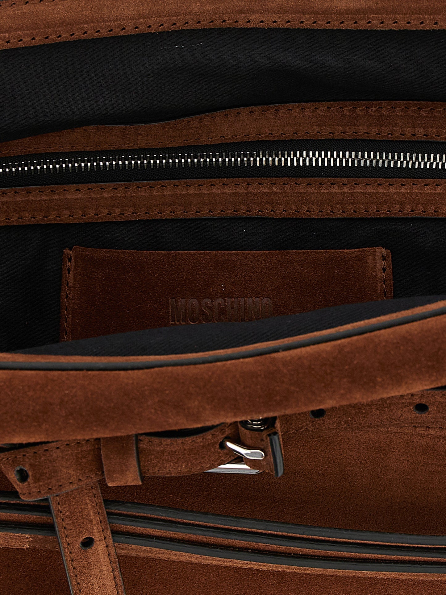 Shoulder Clutch Handbag by Moschino for women in suede calfskin leather brown & silver features a architectural silhouette, showcasing a secure zipper & buckle, ample , and versatile shoulder-strap & adjustable-strap for a architectural finish.
